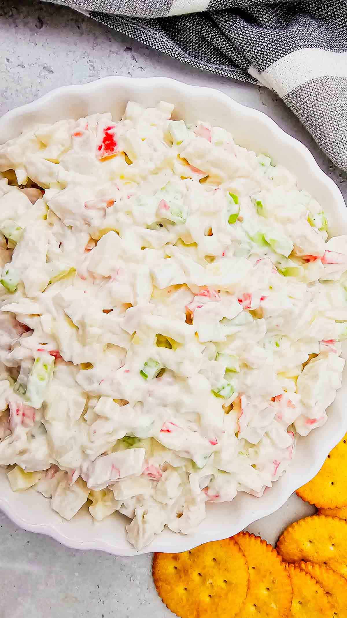 Cold Crab Salad is the easy chilled seafood recipe you’ll want to make all summer long. This creamy crab salad is loaded with imitation crab, crunchy celery, onions and a flavorful dressing for the perfect light lunch, party appetizer or quick dinner idea. Serve it with crackers, pile it onto sandwich rolls, stuff it into croissants or enjoy it straight from the bowl for an easy no cook meal. This cold crab salad recipe is perfect for potlucks, picnics, BBQs, beach lunches and meal prep because it comes together fast with simple ingredients. If you love easy seafood salad recipes, crab salad sandwiches, cold lunch ideas and refreshing summer recipes, this creamy imitation crab salad is guaranteed to become a family favorite.