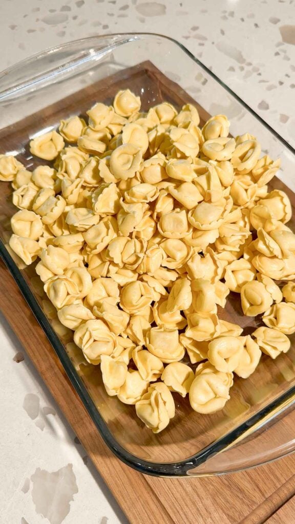 refrigerated tortellini poured into a baking dish
