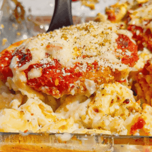 This Dump and Bake Chicken Parm Tortellini Alfredo is the ultimate easy comfort food dinner for busy weeknights, lazy dinners and family meals everyone will love. Made with refrigerated cheese and bacon tortellini, creamy jarred Alfredo sauce, crispy breaded chicken burgers, rich marinara sauce and gooey melted mozzarella, this baked pasta casserole comes together in one dish with almost no prep. If you love easy chicken parm recipes, dump dinners, baked tortellini recipes, cheesy pasta casseroles and simple family dinner ideas, this recipe is a must-try. Perfect for quick weeknight dinners, freezer meals, potlucks and cozy comfort food cravings, this creamy chicken parmesan tortellini bake is loaded with flavour, cheesy layers and hearty pasta goodness in every bite.