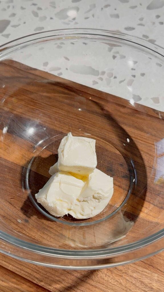 mayo and cubes of cream cheese in a glass bowl