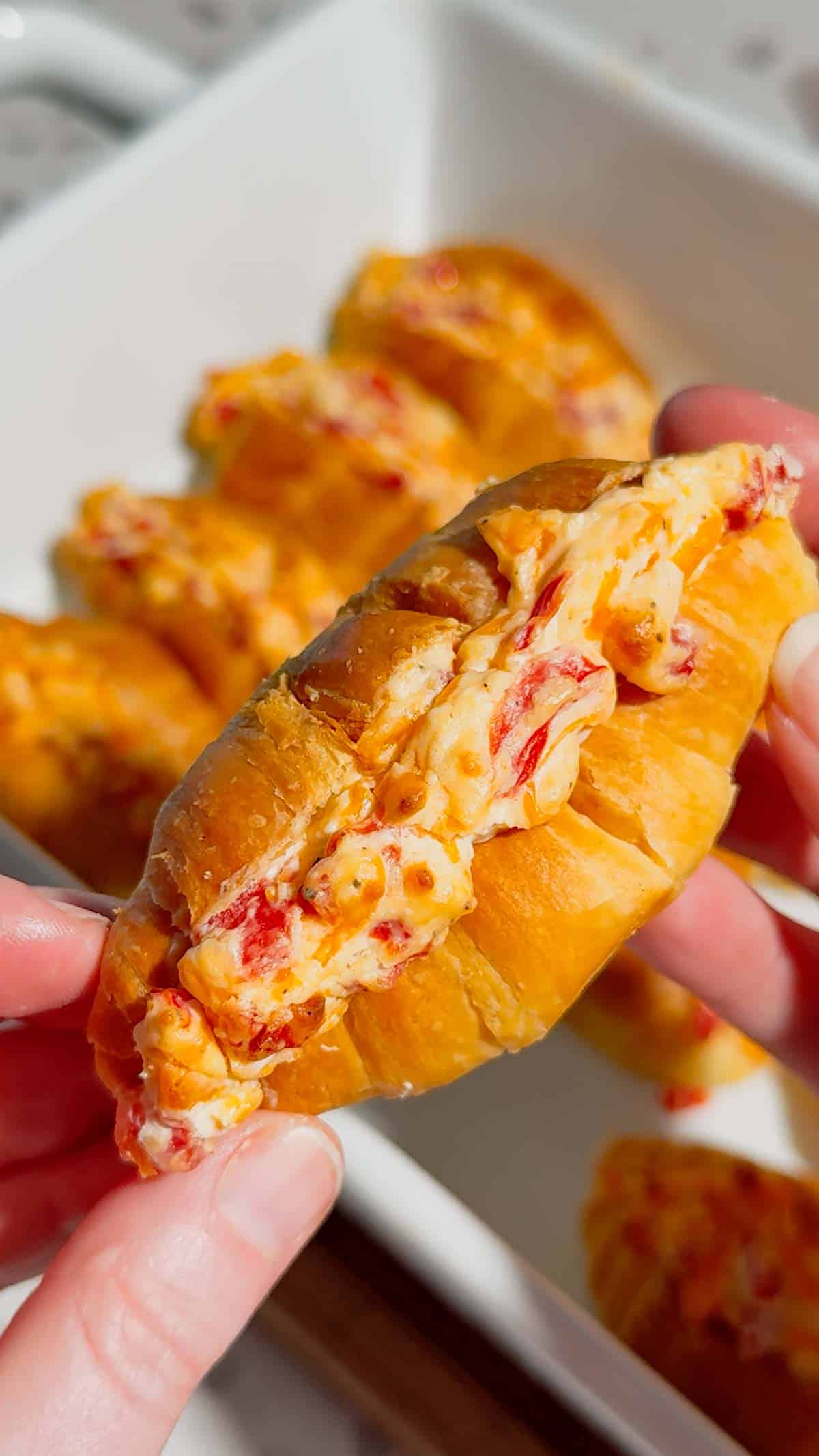 These Pimento Cheese Mini Croissants are the ultimate easy party appetizer for holidays, game day spreads, brunch tables and casual entertaining. Mini butter croissants are sliced open and stuffed with creamy homemade pimento cheese made with sharp cheddar, mayo, cream cheese and diced pimentos, then baked until warm, melty and golden brown. These cheesy baked croissant sandwiches are rich, buttery and packed with bold Southern-inspired flavour in every bite. Perfect for make ahead entertaining, easy finger foods, football snacks, brunch recipes, appetizer trays and quick baked party food ideas. If you love easy croissant recipes, cheesy appetizers, baked sandwiches and crowd pleasing snacks, this easy recipe is a must try.
