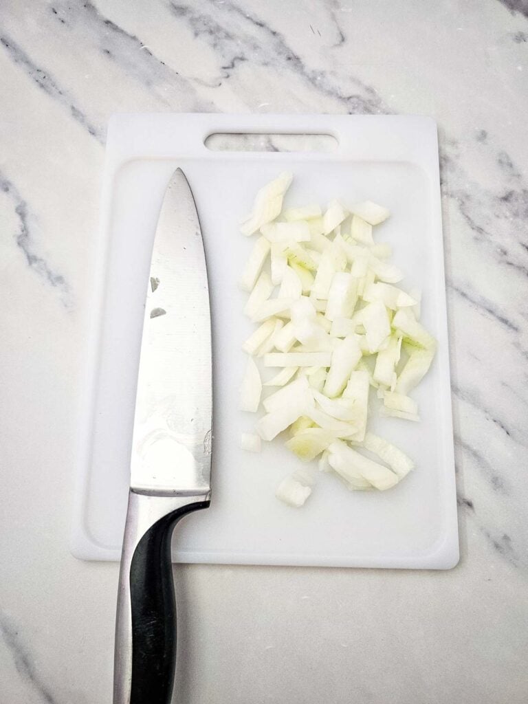chopped onions on a cutting board