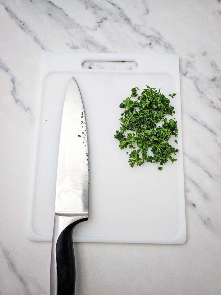 chopped parsley on a cutting board