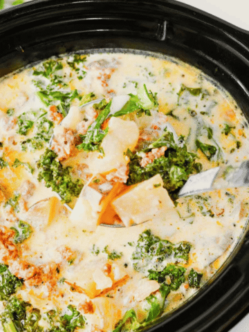 This Crockpot Zuppa Toscana is the ultimate comfort soup recipe loaded with Italian sausage, potatoes, bacon, kale and a rich creamy broth. If you love Copycat Olive Garden Zuppa Toscana, this Slow Cooker Zuppa Toscana is an easy family dinner that tastes even better than the restaurant version. Learn How To Make Olive Garden Zuppa Toscana at home with simple ingredients and minimal prep. This Zuppa Toscana Soup Recipe is perfect for busy weeknights, cozy weekends and feeding a crowd. Whether you're searching for Easy Soup Recipes, Italian Soup Recipes, Sausage And Kale Soup, Kale Soup Recipes, Homemade Soup Recipe ideas or a delicious Crockpot Zuppa Toscana, this hearty Toscana Soup delivers big flavor in every bite. Save this Easy Zuppa Toscana Soup for your next Soup Dinner night!