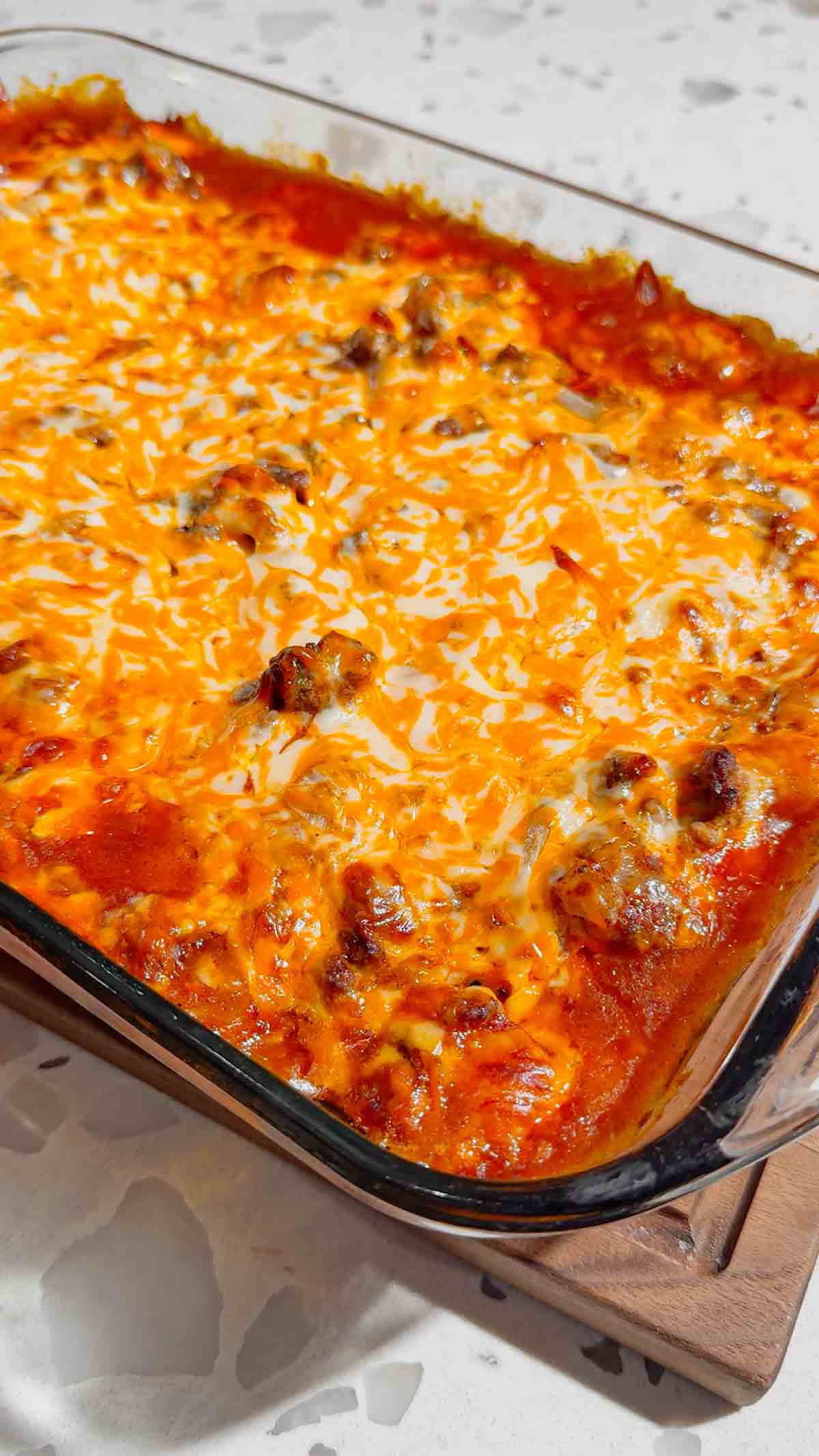 If you're looking for an easy comfort food dinner that combines Mexican-inspired flavors with hearty family-friendly ingredients, this Beef Enchilada Pierogies recipe is a must-try. Frozen pierogies are layered in a baking dish, topped with seasoned ground beef, rich red enchilada sauce, and plenty of melted cheddar cheese for a simple weeknight meal everyone will love. This easy casserole recipe is perfect for busy nights, potlucks, meal prep, and budget-friendly dinners. Whether you're searching for Ground Beef Dinner Recipes, Easy Casserole Recipes, Enchilada Casserole Ideas, Pierogi Casserole Recipes, Frozen Pierogies Recipes, or Cheesy Beef Bakes, this recipe delivers big flavor with minimal effort. The combination of tender potato-filled pierogies, savory beef, zesty enchilada sauce, and gooey cheese creates the ultimate comfort food casserole. Save this Easy Beef Enchilada Pierogies Bake for quick family dinners, freezer meals, cozy weeknight suppers, and crowd-pleasing comfort food recipes that are guaranteed to disappear fast.