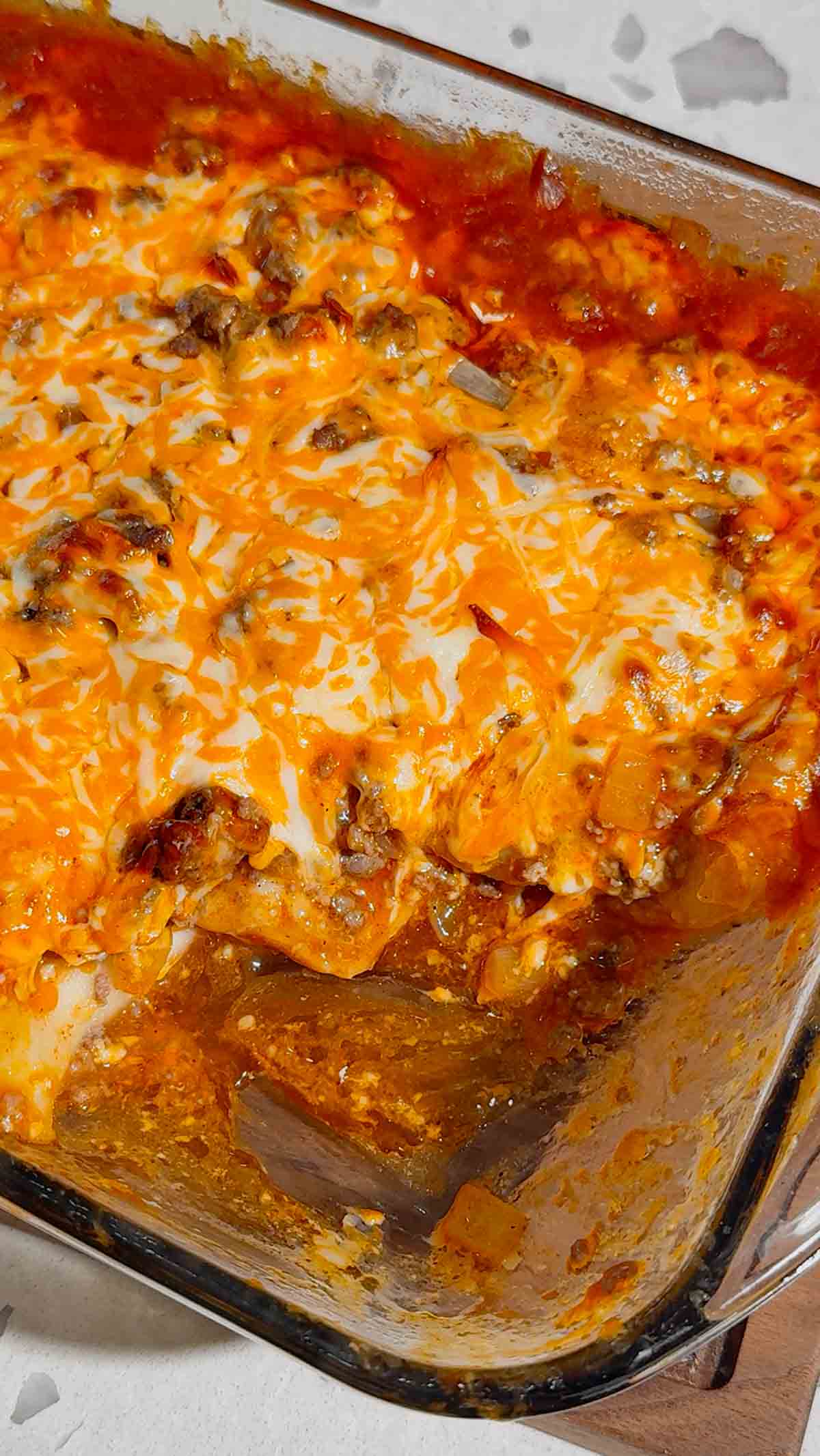 If you're looking for an easy comfort food dinner that combines Mexican-inspired flavors with hearty family-friendly ingredients, this Beef Enchilada Pierogies recipe is a must-try. Frozen pierogies are layered in a baking dish, topped with seasoned ground beef, rich red enchilada sauce, and plenty of melted cheddar cheese for a simple weeknight meal everyone will love. This easy casserole recipe is perfect for busy nights, potlucks, meal prep, and budget-friendly dinners. Whether you're searching for Ground Beef Dinner Recipes, Easy Casserole Recipes, Enchilada Casserole Ideas, Pierogi Casserole Recipes, Frozen Pierogies Recipes, or Cheesy Beef Bakes, this recipe delivers big flavor with minimal effort. The combination of tender potato-filled pierogies, savory beef, zesty enchilada sauce, and gooey cheese creates the ultimate comfort food casserole. Save this Easy Beef Enchilada Pierogies Bake for quick family dinners, freezer meals, cozy weeknight suppers, and crowd-pleasing comfort food recipes that are guaranteed to disappear fast.
