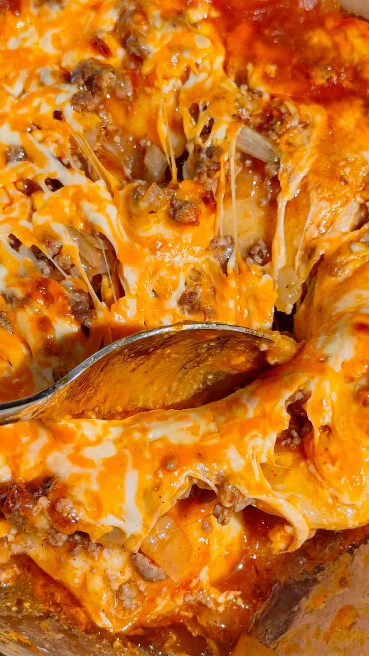 If you're looking for an easy comfort food dinner that combines Mexican-inspired flavors with hearty family-friendly ingredients, this Beef Enchilada Pierogies recipe is a must-try. Frozen pierogies are layered in a baking dish, topped with seasoned ground beef, rich red enchilada sauce, and plenty of melted cheddar cheese for a simple weeknight meal everyone will love. This easy casserole recipe is perfect for busy nights, potlucks, meal prep, and budget-friendly dinners. Whether you're searching for Ground Beef Dinner Recipes, Easy Casserole Recipes, Enchilada Casserole Ideas, Pierogi Casserole Recipes, Frozen Pierogies Recipes, or Cheesy Beef Bakes, this recipe delivers big flavor with minimal effort. The combination of tender potato-filled pierogies, savory beef, zesty enchilada sauce, and gooey cheese creates the ultimate comfort food casserole. Save this Easy Beef Enchilada Pierogies Bake for quick family dinners, freezer meals, cozy weeknight suppers, and crowd-pleasing comfort food recipes that are guaranteed to disappear fast.