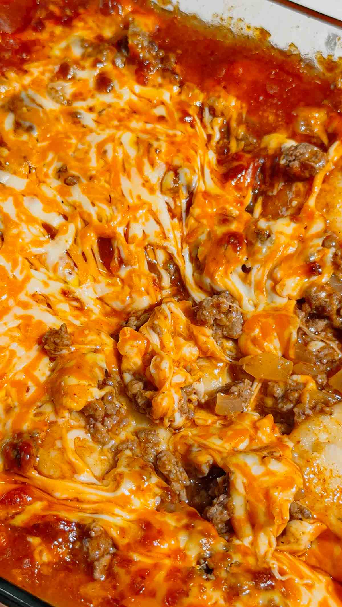If you're looking for an easy comfort food dinner that combines Mexican-inspired flavors with hearty family-friendly ingredients, this Beef Enchilada Pierogies recipe is a must-try. Frozen pierogies are layered in a baking dish, topped with seasoned ground beef, rich red enchilada sauce, and plenty of melted cheddar cheese for a simple weeknight meal everyone will love. This easy casserole recipe is perfect for busy nights, potlucks, meal prep, and budget-friendly dinners. Whether you're searching for Ground Beef Dinner Recipes, Easy Casserole Recipes, Enchilada Casserole Ideas, Pierogi Casserole Recipes, Frozen Pierogies Recipes, or Cheesy Beef Bakes, this recipe delivers big flavor with minimal effort. The combination of tender potato-filled pierogies, savory beef, zesty enchilada sauce, and gooey cheese creates the ultimate comfort food casserole. Save this Easy Beef Enchilada Pierogies Bake for quick family dinners, freezer meals, cozy weeknight suppers, and crowd-pleasing comfort food recipes that are guaranteed to disappear fast.
