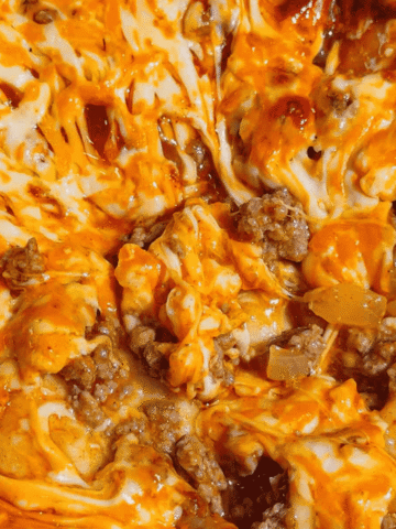 If you're looking for an easy comfort food dinner that combines Mexican-inspired flavors with hearty family-friendly ingredients, this Beef Enchilada Pierogies recipe is a must-try. Frozen pierogies are layered in a baking dish, topped with seasoned ground beef, rich red enchilada sauce, and plenty of melted cheddar cheese for a simple weeknight meal everyone will love. This easy casserole recipe is perfect for busy nights, potlucks, meal prep, and budget-friendly dinners. Whether you're searching for Ground Beef Dinner Recipes, Easy Casserole Recipes, Enchilada Casserole Ideas, Pierogi Casserole Recipes, Frozen Pierogies Recipes, or Cheesy Beef Bakes, this recipe delivers big flavor with minimal effort. The combination of tender potato-filled pierogies, savory beef, zesty enchilada sauce, and gooey cheese creates the ultimate comfort food casserole. Save this Easy Beef Enchilada Pierogies Bake for quick family dinners, freezer meals, cozy weeknight suppers, and crowd-pleasing comfort food recipes that are guaranteed to disappear fast.