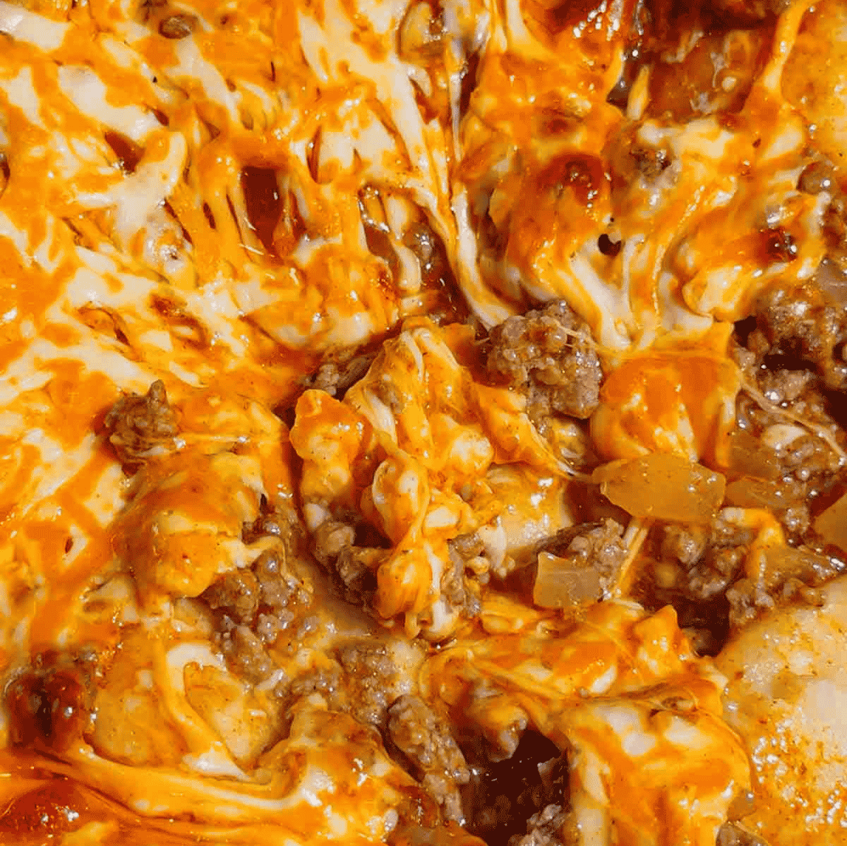 If you're looking for an easy comfort food dinner that combines Mexican-inspired flavors with hearty family-friendly ingredients, this Beef Enchilada Pierogies recipe is a must-try. Frozen pierogies are layered in a baking dish, topped with seasoned ground beef, rich red enchilada sauce, and plenty of melted cheddar cheese for a simple weeknight meal everyone will love. This easy casserole recipe is perfect for busy nights, potlucks, meal prep, and budget-friendly dinners. Whether you're searching for Ground Beef Dinner Recipes, Easy Casserole Recipes, Enchilada Casserole Ideas, Pierogi Casserole Recipes, Frozen Pierogies Recipes, or Cheesy Beef Bakes, this recipe delivers big flavor with minimal effort. The combination of tender potato-filled pierogies, savory beef, zesty enchilada sauce, and gooey cheese creates the ultimate comfort food casserole. Save this Easy Beef Enchilada Pierogies Bake for quick family dinners, freezer meals, cozy weeknight suppers, and crowd-pleasing comfort food recipes that are guaranteed to disappear fast.