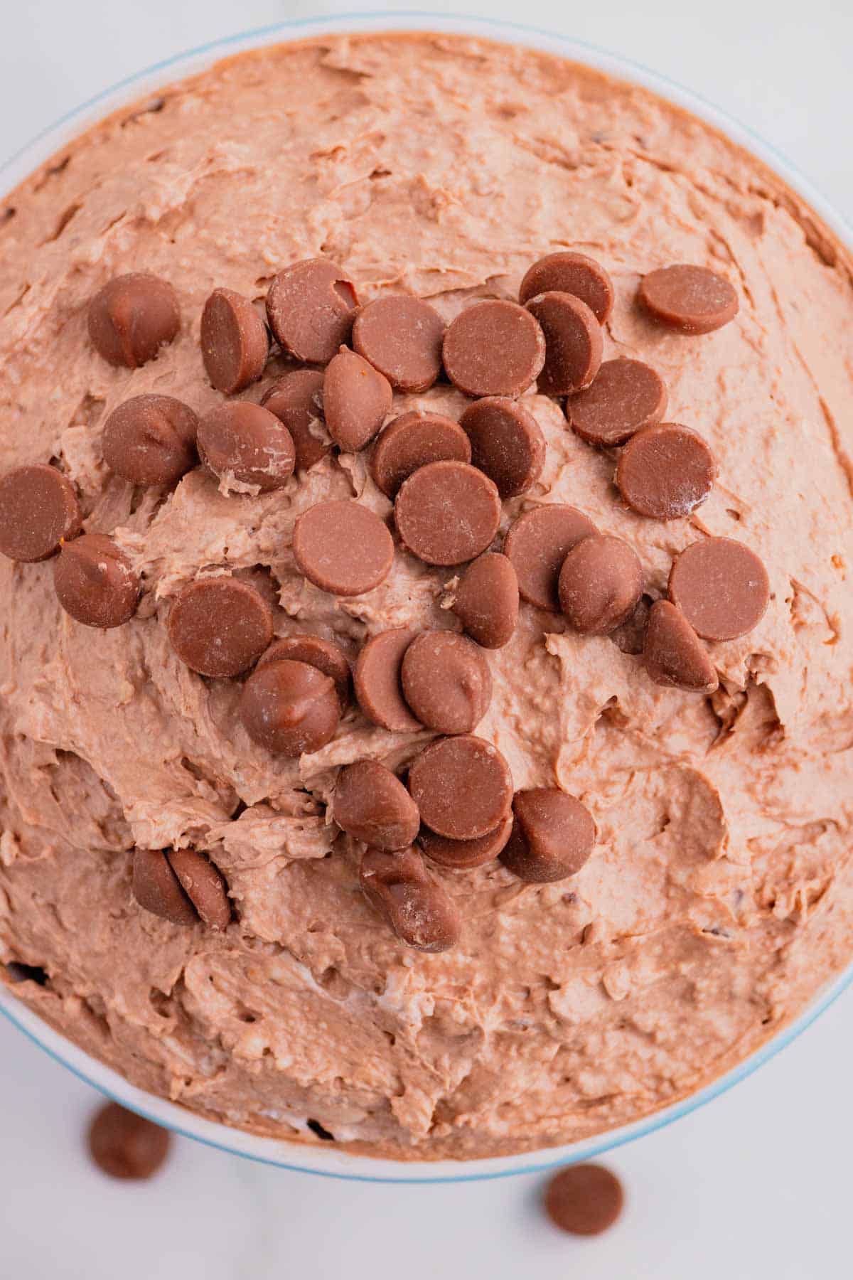 Craving chocolate but don’t feel like baking? This Brownie Batter Dip is the ultimate no-bake dessert that comes together in just 5 minutes with cream cheese, Cool Whip, brownie mix, and mini chocolate chips. Rich, creamy, and packed with classic brownie batter flavor, this easy dessert dip is perfect for parties, game day spreads, movie nights, holiday gatherings, and last-minute sweet cravings. Serve it with graham crackers, vanilla wafers, pretzels, strawberries, apple slices, or cookies for an irresistible treat everyone will love. If you're looking for easy dessert recipes, chocolate dip recipes, no bake desserts, brownie batter desserts, party food ideas, and quick sweet treats, this crowd-pleasing dip is guaranteed to disappear fast. Save this simple brownie batter dip recipe for your next celebration!