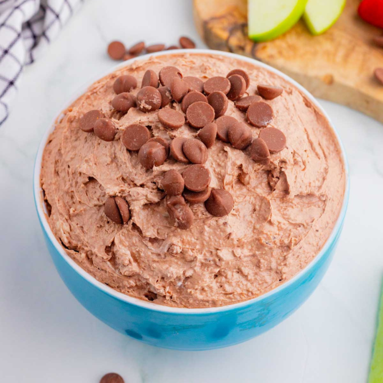 Craving chocolate but don’t feel like baking? This Brownie Batter Dip is the ultimate no-bake dessert that comes together in just 5 minutes with cream cheese, Cool Whip, brownie mix, and mini chocolate chips. Rich, creamy, and packed with classic brownie batter flavor, this easy dessert dip is perfect for parties, game day spreads, movie nights, holiday gatherings, and last-minute sweet cravings. Serve it with graham crackers, vanilla wafers, pretzels, strawberries, apple slices, or cookies for an irresistible treat everyone will love. If you're looking for easy dessert recipes, chocolate dip recipes, no bake desserts, brownie batter desserts, party food ideas, and quick sweet treats, this crowd-pleasing dip is guaranteed to disappear fast. Save this simple brownie batter dip recipe for your next celebration!