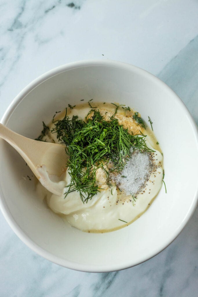 ingredients for homemade ranch dressing in a mixing bowl