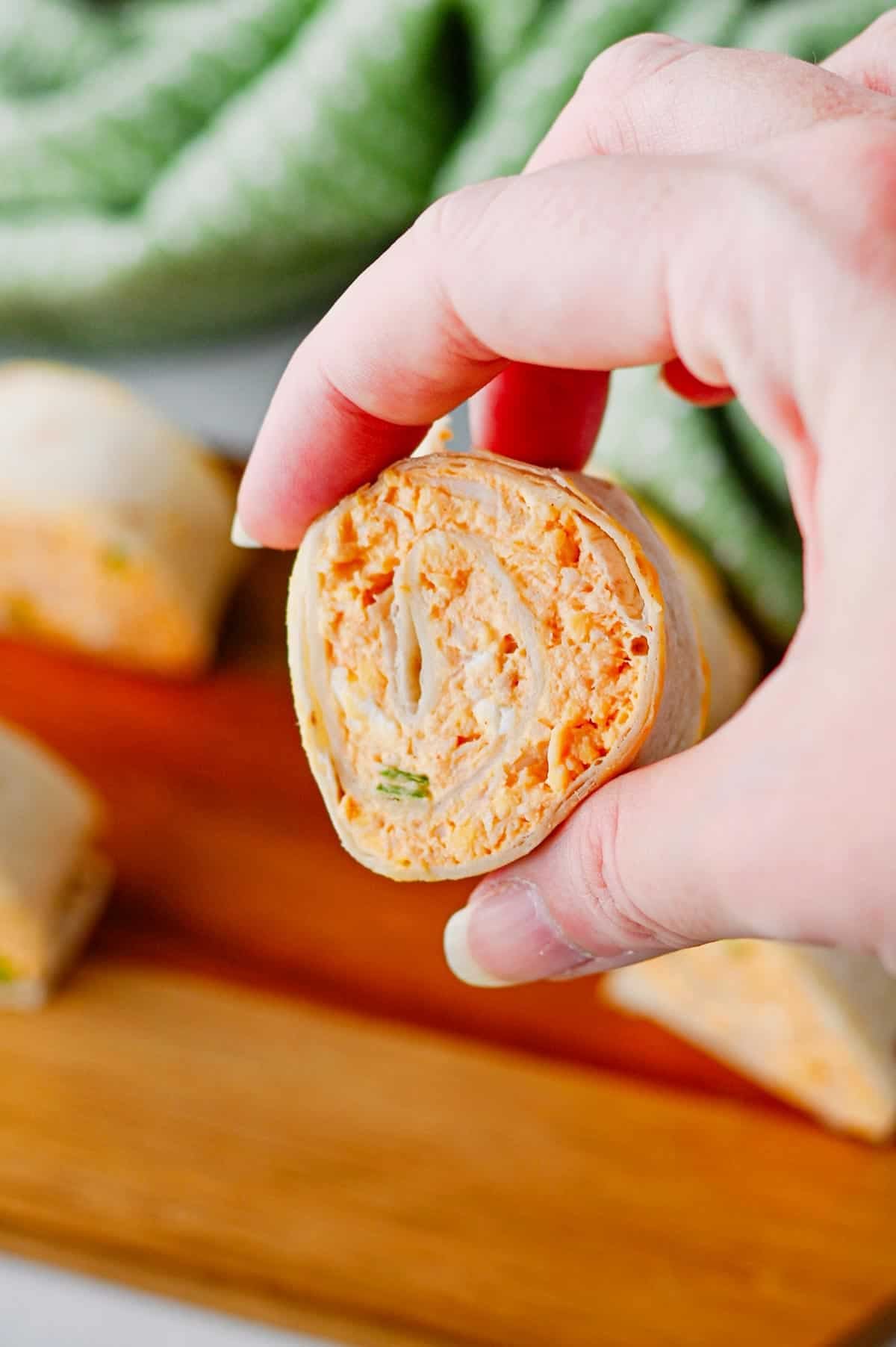 These Buffalo Chicken Pinwheels are the ultimate easy appetizer for parties, game day snacks, potlucks, tailgating, and holiday gatherings. Made with shredded chicken, cream cheese, cheddar cheese, ranch dressing, buffalo sauce, blue cheese crumbles, and flour tortillas, these Buffalo Chicken Tortilla Roll Ups are packed with bold flavor in every bite. If you're searching for Buffalo Chicken Pinwheel Recipes, Buffalo Chicken Roll Ups, Chicken Pinwheels, Tortilla Pinwheels, Ranch Chicken Pinwheels, Easy Party Appetizers, Finger Food Recipes, Game Day Appetizers, Make Ahead Appetizers, Cold Appetizers, Football Party Food, Tailgate Food Ideas, or Crowd Pleasing Snacks, this simple recipe is guaranteed to be a hit. Perfect for entertaining, meal prep, and easy snack trays.