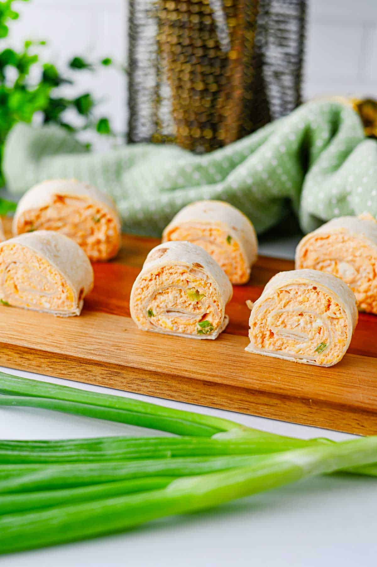 These Buffalo Chicken Pinwheels are the ultimate easy appetizer for parties, game day snacks, potlucks, tailgating, and holiday gatherings. Made with shredded chicken, cream cheese, cheddar cheese, ranch dressing, buffalo sauce, blue cheese crumbles, and flour tortillas, these Buffalo Chicken Tortilla Roll Ups are packed with bold flavor in every bite. If you're searching for Buffalo Chicken Pinwheel Recipes, Buffalo Chicken Roll Ups, Chicken Pinwheels, Tortilla Pinwheels, Ranch Chicken Pinwheels, Easy Party Appetizers, Finger Food Recipes, Game Day Appetizers, Make Ahead Appetizers, Cold Appetizers, Football Party Food, Tailgate Food Ideas, or Crowd Pleasing Snacks, this simple recipe is guaranteed to be a hit. Perfect for entertaining, meal prep, and easy snack trays.