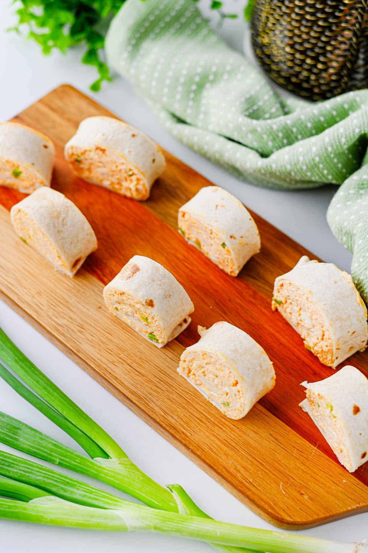 These Buffalo Chicken Pinwheels are the ultimate easy appetizer for parties, game day snacks, potlucks, tailgating, and holiday gatherings. Made with shredded chicken, cream cheese, cheddar cheese, ranch dressing, buffalo sauce, blue cheese crumbles, and flour tortillas, these Buffalo Chicken Tortilla Roll Ups are packed with bold flavor in every bite. If you're searching for Buffalo Chicken Pinwheel Recipes, Buffalo Chicken Roll Ups, Chicken Pinwheels, Tortilla Pinwheels, Ranch Chicken Pinwheels, Easy Party Appetizers, Finger Food Recipes, Game Day Appetizers, Make Ahead Appetizers, Cold Appetizers, Football Party Food, Tailgate Food Ideas, or Crowd Pleasing Snacks, this simple recipe is guaranteed to be a hit. Perfect for entertaining, meal prep, and easy snack trays.
