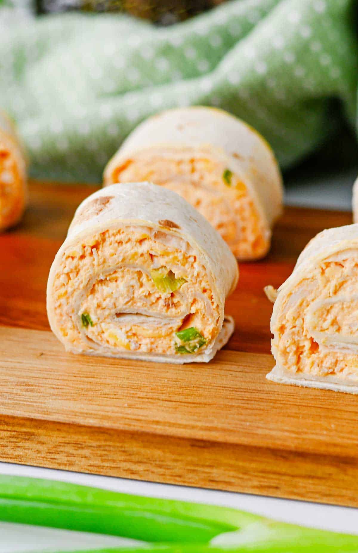 These Buffalo Chicken Pinwheels are the ultimate easy appetizer for parties, game day snacks, potlucks, tailgating, and holiday gatherings. Made with shredded chicken, cream cheese, cheddar cheese, ranch dressing, buffalo sauce, blue cheese crumbles, and flour tortillas, these Buffalo Chicken Tortilla Roll Ups are packed with bold flavor in every bite. If you're searching for Buffalo Chicken Pinwheel Recipes, Buffalo Chicken Roll Ups, Chicken Pinwheels, Tortilla Pinwheels, Ranch Chicken Pinwheels, Easy Party Appetizers, Finger Food Recipes, Game Day Appetizers, Make Ahead Appetizers, Cold Appetizers, Football Party Food, Tailgate Food Ideas, or Crowd Pleasing Snacks, this simple recipe is guaranteed to be a hit. Perfect for entertaining, meal prep, and easy snack trays.