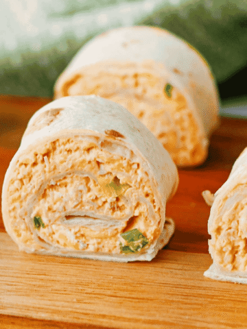 These Buffalo Chicken Pinwheels are the ultimate easy appetizer for parties, game day snacks, potlucks, tailgating, and holiday gatherings. Made with shredded chicken, cream cheese, cheddar cheese, ranch dressing, buffalo sauce, blue cheese crumbles, and flour tortillas, these Buffalo Chicken Tortilla Roll Ups are packed with bold flavor in every bite. If you're searching for Buffalo Chicken Pinwheel Recipes, Buffalo Chicken Roll Ups, Chicken Pinwheels, Tortilla Pinwheels, Ranch Chicken Pinwheels, Easy Party Appetizers, Finger Food Recipes, Game Day Appetizers, Make Ahead Appetizers, Cold Appetizers, Football Party Food, Tailgate Food Ideas, or Crowd Pleasing Snacks, this simple recipe is guaranteed to be a hit. Perfect for entertaining, meal prep, and easy snack trays.