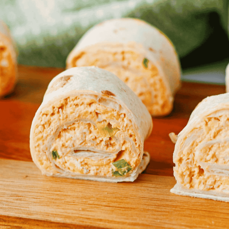 These Buffalo Chicken Pinwheels are the ultimate easy appetizer for parties, game day snacks, potlucks, tailgating, and holiday gatherings. Made with shredded chicken, cream cheese, cheddar cheese, ranch dressing, buffalo sauce, blue cheese crumbles, and flour tortillas, these Buffalo Chicken Tortilla Roll Ups are packed with bold flavor in every bite. If you're searching for Buffalo Chicken Pinwheel Recipes, Buffalo Chicken Roll Ups, Chicken Pinwheels, Tortilla Pinwheels, Ranch Chicken Pinwheels, Easy Party Appetizers, Finger Food Recipes, Game Day Appetizers, Make Ahead Appetizers, Cold Appetizers, Football Party Food, Tailgate Food Ideas, or Crowd Pleasing Snacks, this simple recipe is guaranteed to be a hit. Perfect for entertaining, meal prep, and easy snack trays.