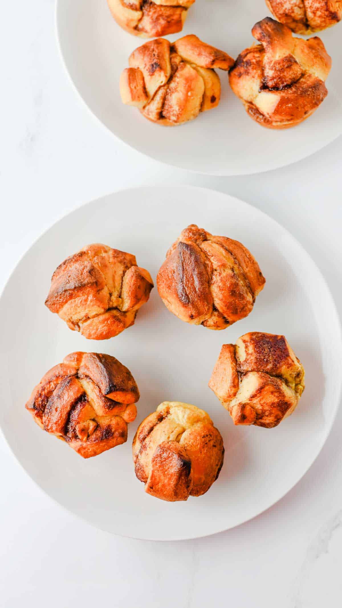 These Cinnamon Roll Muffins are the ultimate easy breakfast recipe for busy mornings, holiday brunches and weekend baking. Made with Pillsbury cinnamon rolls, eggs, heavy cream, cinnamon and vanilla, these soft and fluffy muffins have all the flavour of classic cinnamon rolls in a convenient grab-and-go form. The chopped cinnamon roll pieces bake up perfectly in muffin tins while the rich custard mixture creates a tender, bakery-style texture. Once baked, they're topped with the sweet cream cheese frosting for an irresistible finish. Whether you're looking for an easy brunch recipe, a simple make-ahead breakfast or a fun twist on canned cinnamon rolls, these Cinnamon Roll Muffins are guaranteed to be a family favourite.
