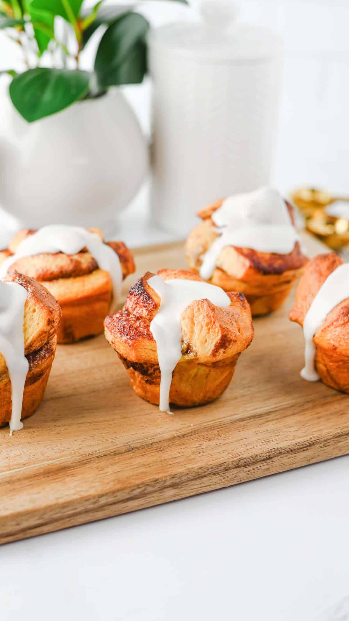 These Cinnamon Roll Muffins are the ultimate easy breakfast recipe for busy mornings, holiday brunches and weekend baking. Made with Pillsbury cinnamon rolls, eggs, heavy cream, cinnamon and vanilla, these soft and fluffy muffins have all the flavour of classic cinnamon rolls in a convenient grab-and-go form. The chopped cinnamon roll pieces bake up perfectly in muffin tins while the rich custard mixture creates a tender, bakery-style texture. Once baked, they're topped with the sweet cream cheese frosting for an irresistible finish. Whether you're looking for an easy brunch recipe, a simple make-ahead breakfast or a fun twist on canned cinnamon rolls, these Cinnamon Roll Muffins are guaranteed to be a family favourite.