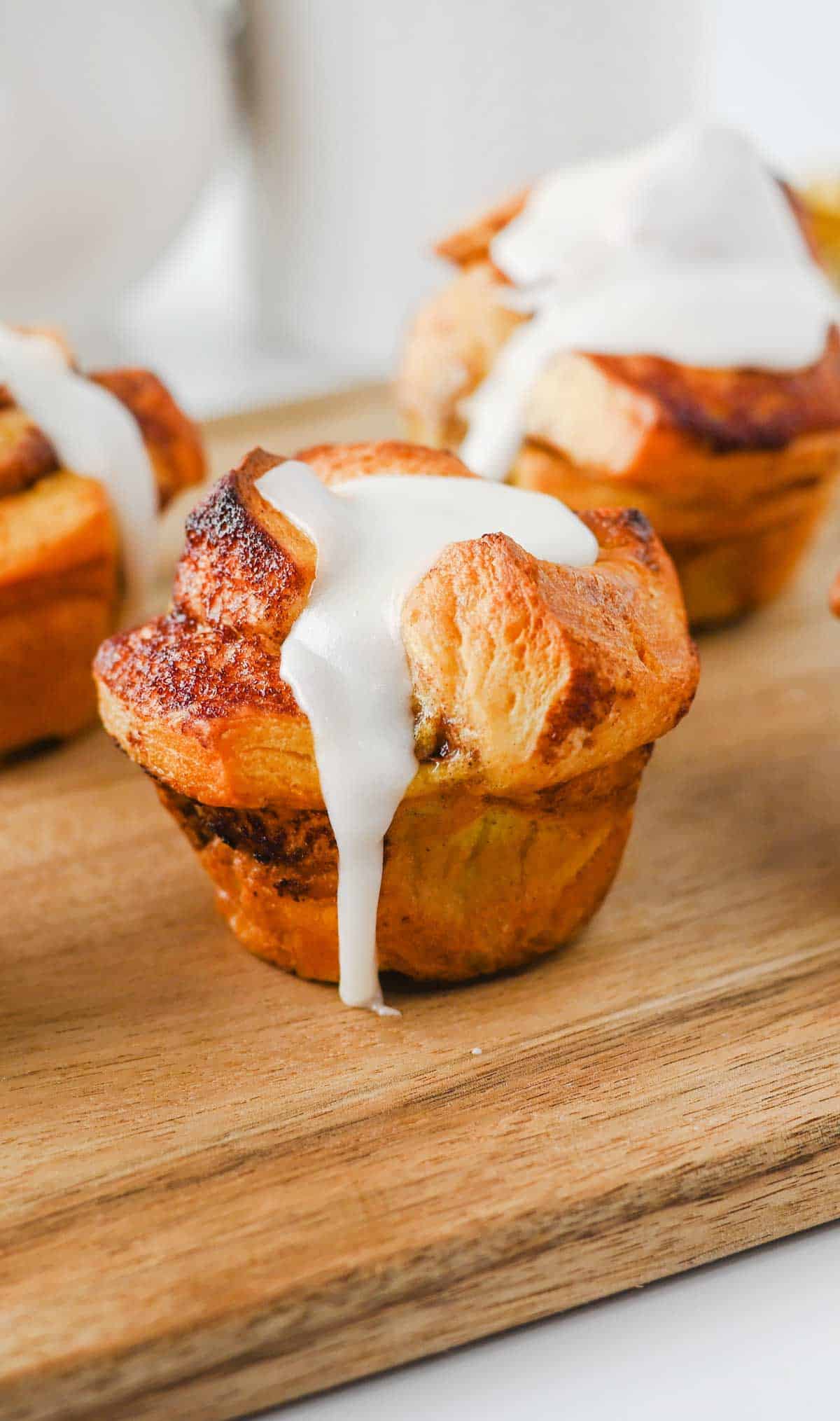 These Cinnamon Roll Muffins are the ultimate easy breakfast recipe for busy mornings, holiday brunches and weekend baking. Made with Pillsbury cinnamon rolls, eggs, heavy cream, cinnamon and vanilla, these soft and fluffy muffins have all the flavour of classic cinnamon rolls in a convenient grab-and-go form. The chopped cinnamon roll pieces bake up perfectly in muffin tins while the rich custard mixture creates a tender, bakery-style texture. Once baked, they're topped with the sweet cream cheese frosting for an irresistible finish. Whether you're looking for an easy brunch recipe, a simple make-ahead breakfast or a fun twist on canned cinnamon rolls, these Cinnamon Roll Muffins are guaranteed to be a family favourite.