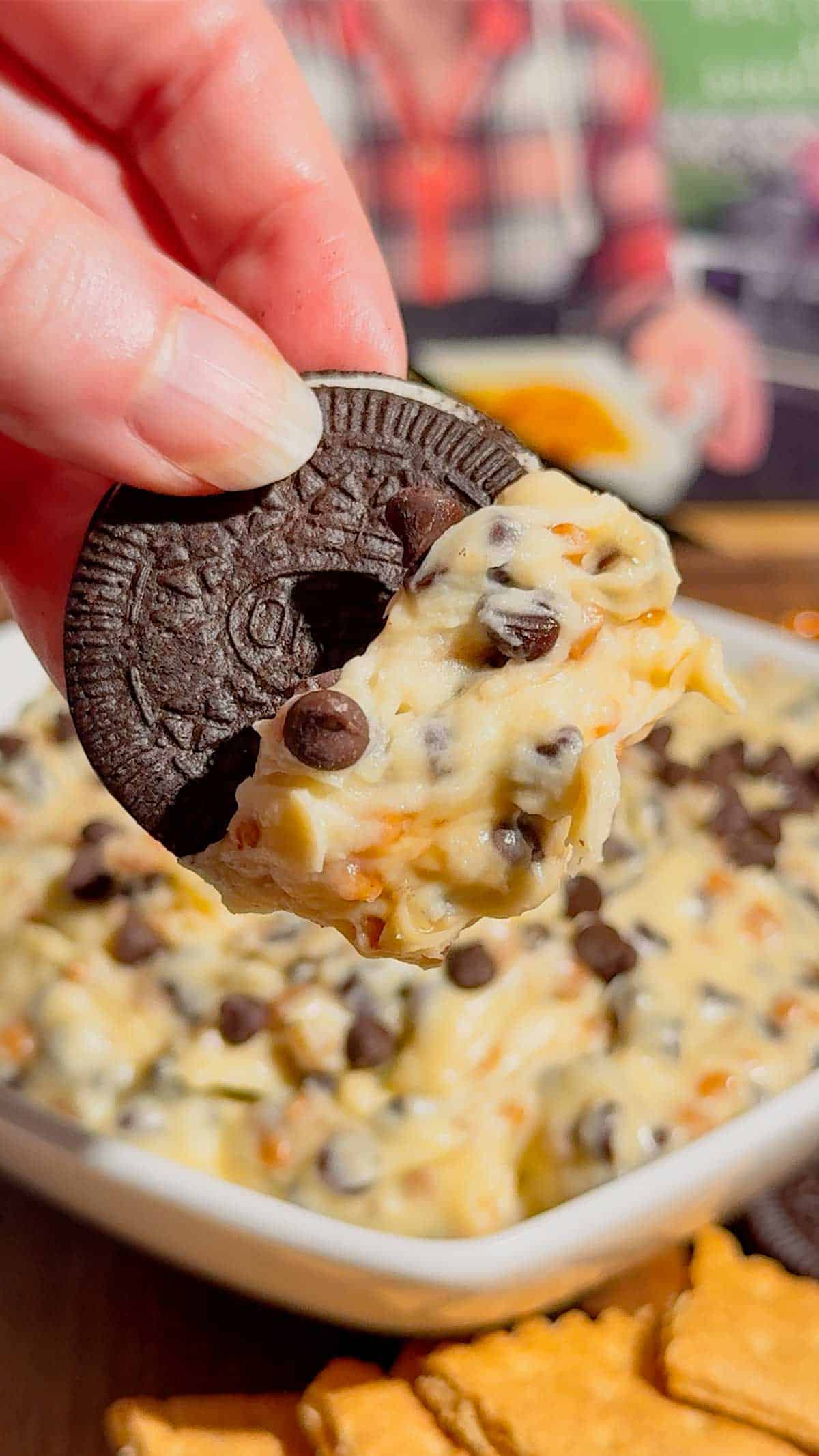 Looking for the ultimate Cookie Dough Dip recipe? This easy No Bake Dessert Dip is rich, creamy, and loaded with mini chocolate chips and crunchy toffee bits for the perfect sweet treat. Ready in just 10 minutes, this Chocolate Chip Cookie Dough Dip is ideal for parties, game day, movie nights, birthdays, potlucks, holiday dessert tables, and family gatherings. Serve it with graham crackers, vanilla wafers, pretzels, apple slices, strawberries, or cookies for an irresistible dessert everyone will love. If you need an easy dessert dip, sweet party snack, no bake dessert recipe, or crowd-pleasing treat, this homemade cookie dough dip is guaranteed to disappear fast and become a favorite for every occasion.