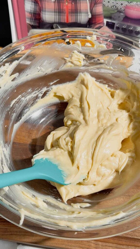cream cheese, butter and sugar mixture in a mixing bowl