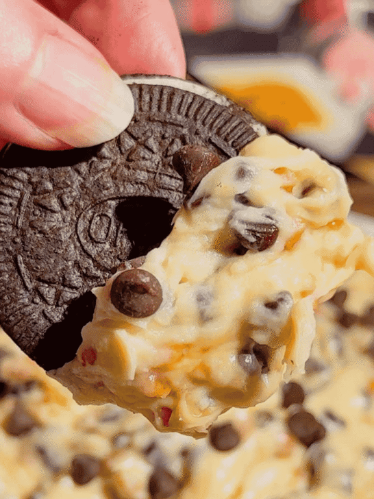 Looking for the ultimate Cookie Dough Dip recipe? This easy No Bake Dessert Dip is rich, creamy, and loaded with mini chocolate chips and crunchy toffee bits for the perfect sweet treat. Ready in just 10 minutes, this Chocolate Chip Cookie Dough Dip is ideal for parties, game day, movie nights, birthdays, potlucks, holiday dessert tables, and family gatherings. Serve it with graham crackers, vanilla wafers, pretzels, apple slices, strawberries, or cookies for an irresistible dessert everyone will love. If you need an easy dessert dip, sweet party snack, no bake dessert recipe, or crowd-pleasing treat, this homemade cookie dough dip is guaranteed to disappear fast and become a favorite for every occasion.