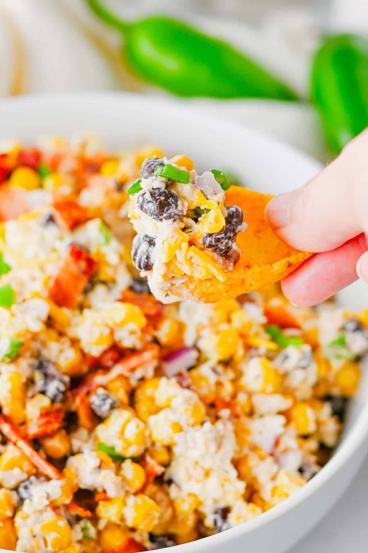 Cowboy Corn Dip is the ultimate party appetizer loaded with sweet corn, black beans, crispy bacon, shredded cheese, jalapeños, and a creamy dressing that comes together in minutes. This easy corn dip recipe is perfect for game day snacks, summer BBQs, potlucks, tailgates, and family gatherings. If you're searching for Corn Dip Recipes, Cold Corn Dip, Mexican Corn Dip, Easy Party Dips, Creamy Corn Dip, Bacon Corn Dip, Corn And Black Bean Dip, Game Day Appetizers, Potluck Recipes, or Crowd Pleasing Snack Ideas, this recipe is a must-try. Serve it with tortilla chips, crackers, or fresh veggies for a delicious appetizer everyone will be coming back for. Quick to make, packed with flavor, and always a hit, this cheesy cowboy dip belongs at every party table.