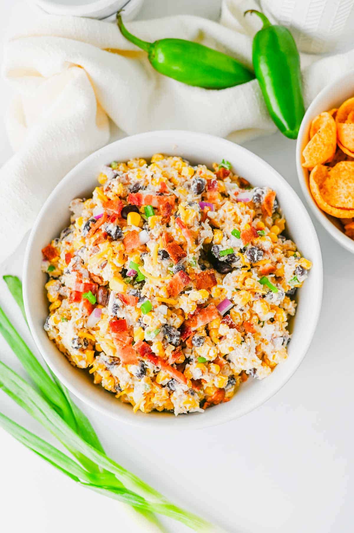 Cowboy Corn Dip is the ultimate party appetizer loaded with sweet corn, black beans, crispy bacon, shredded cheese, jalapeños, and a creamy dressing that comes together in minutes. This easy corn dip recipe is perfect for game day snacks, summer BBQs, potlucks, tailgates, and family gatherings. If you're searching for Corn Dip Recipes, Cold Corn Dip, Mexican Corn Dip, Easy Party Dips, Creamy Corn Dip, Bacon Corn Dip, Corn And Black Bean Dip, Game Day Appetizers, Potluck Recipes, or Crowd Pleasing Snack Ideas, this recipe is a must-try. Serve it with tortilla chips, crackers, or fresh veggies for a delicious appetizer everyone will be coming back for. Quick to make, packed with flavor, and always a hit, this cheesy cowboy dip belongs at every party table.