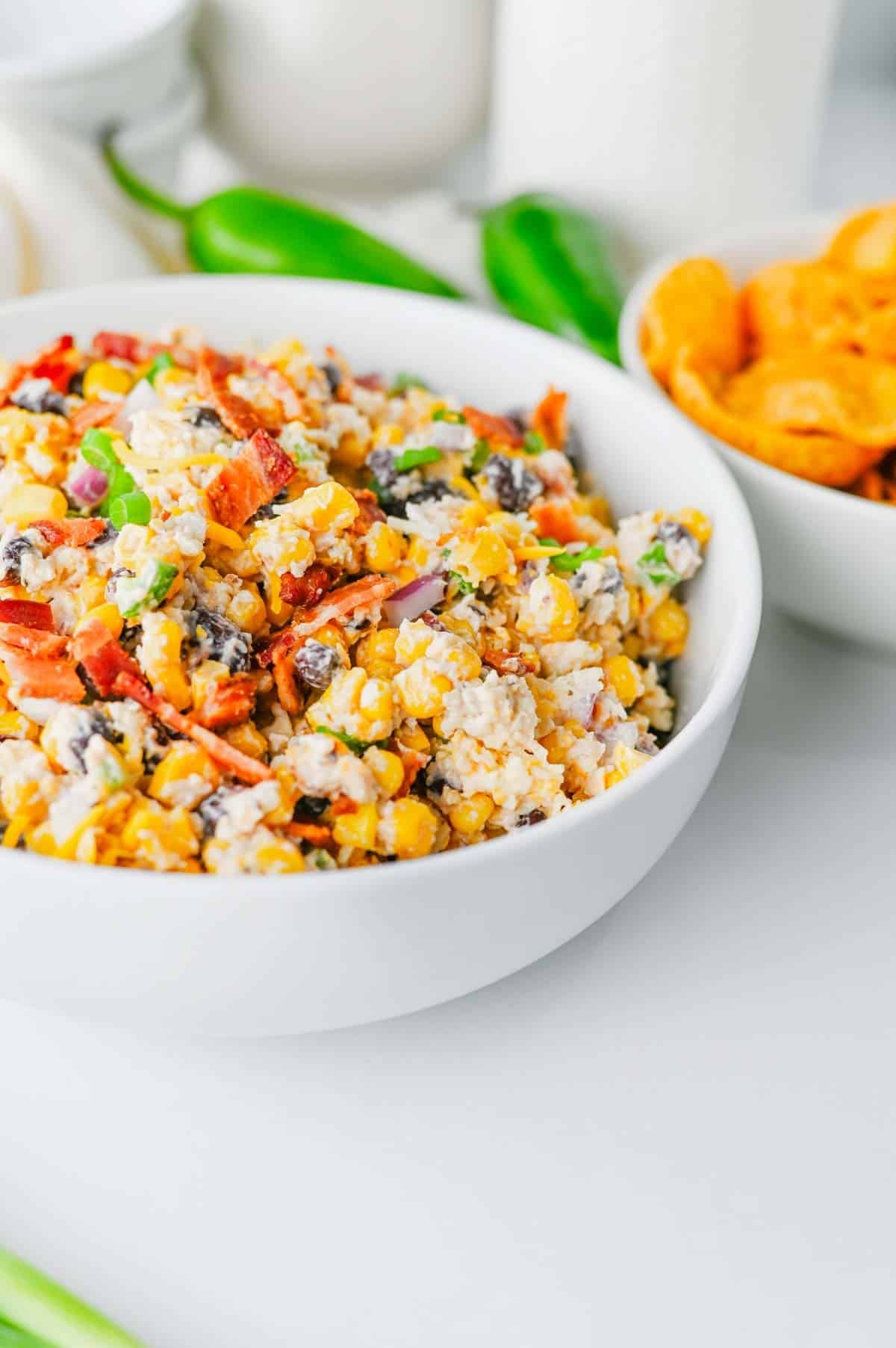 Cowboy Corn Dip is the ultimate party appetizer loaded with sweet corn, black beans, crispy bacon, shredded cheese, jalapeños, and a creamy dressing that comes together in minutes. This easy corn dip recipe is perfect for game day snacks, summer BBQs, potlucks, tailgates, and family gatherings. If you're searching for Corn Dip Recipes, Cold Corn Dip, Mexican Corn Dip, Easy Party Dips, Creamy Corn Dip, Bacon Corn Dip, Corn And Black Bean Dip, Game Day Appetizers, Potluck Recipes, or Crowd Pleasing Snack Ideas, this recipe is a must-try. Serve it with tortilla chips, crackers, or fresh veggies for a delicious appetizer everyone will be coming back for. Quick to make, packed with flavor, and always a hit, this cheesy cowboy dip belongs at every party table.