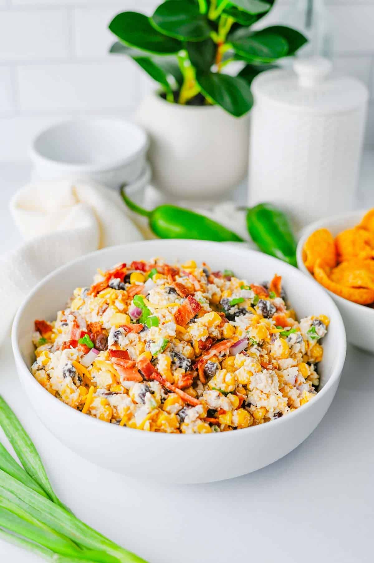 Cowboy Corn Dip is the ultimate party appetizer loaded with sweet corn, black beans, crispy bacon, shredded cheese, jalapeños, and a creamy dressing that comes together in minutes. This easy corn dip recipe is perfect for game day snacks, summer BBQs, potlucks, tailgates, and family gatherings. If you're searching for Corn Dip Recipes, Cold Corn Dip, Mexican Corn Dip, Easy Party Dips, Creamy Corn Dip, Bacon Corn Dip, Corn And Black Bean Dip, Game Day Appetizers, Potluck Recipes, or Crowd Pleasing Snack Ideas, this recipe is a must-try. Serve it with tortilla chips, crackers, or fresh veggies for a delicious appetizer everyone will be coming back for. Quick to make, packed with flavor, and always a hit, this cheesy cowboy dip belongs at every party table.