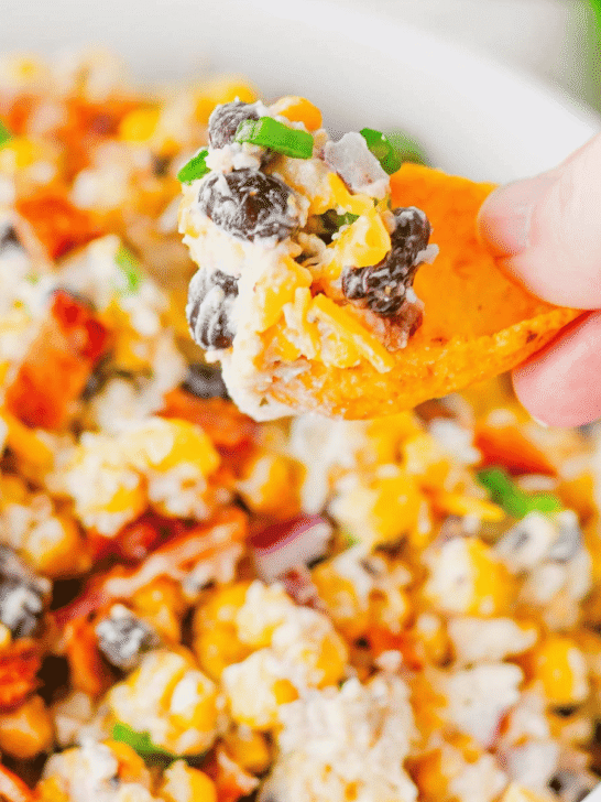 Cowboy Corn Dip is the ultimate party appetizer loaded with sweet corn, black beans, crispy bacon, shredded cheese, jalapeños, and a creamy dressing that comes together in minutes. This easy corn dip recipe is perfect for game day snacks, summer BBQs, potlucks, tailgates, and family gatherings. If you're searching for Corn Dip Recipes, Cold Corn Dip, Mexican Corn Dip, Easy Party Dips, Creamy Corn Dip, Bacon Corn Dip, Corn And Black Bean Dip, Game Day Appetizers, Potluck Recipes, or Crowd Pleasing Snack Ideas, this recipe is a must-try. Serve it with tortilla chips, crackers, or fresh veggies for a delicious appetizer everyone will be coming back for. Quick to make, packed with flavor, and always a hit, this cheesy cowboy dip belongs at every party table.