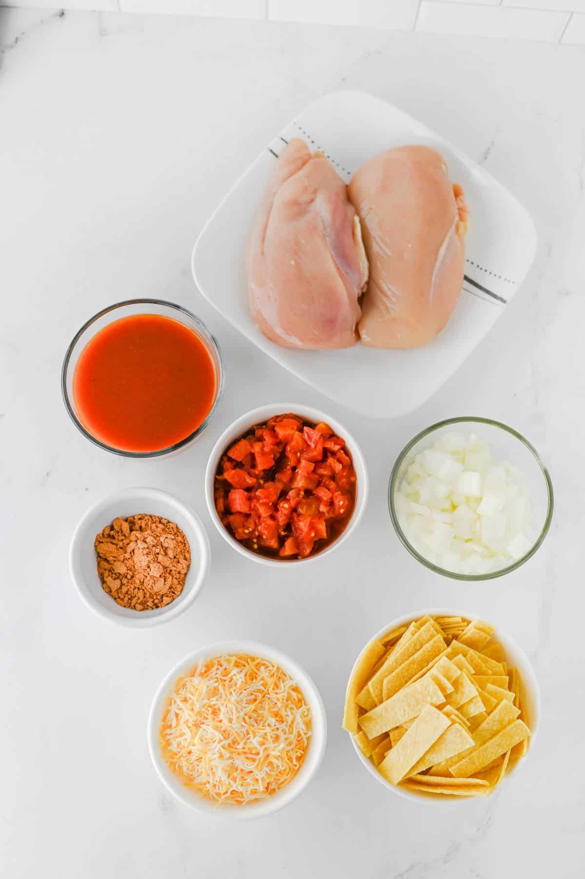 crock pot chicken enchilada ingredients on a kitchen counter