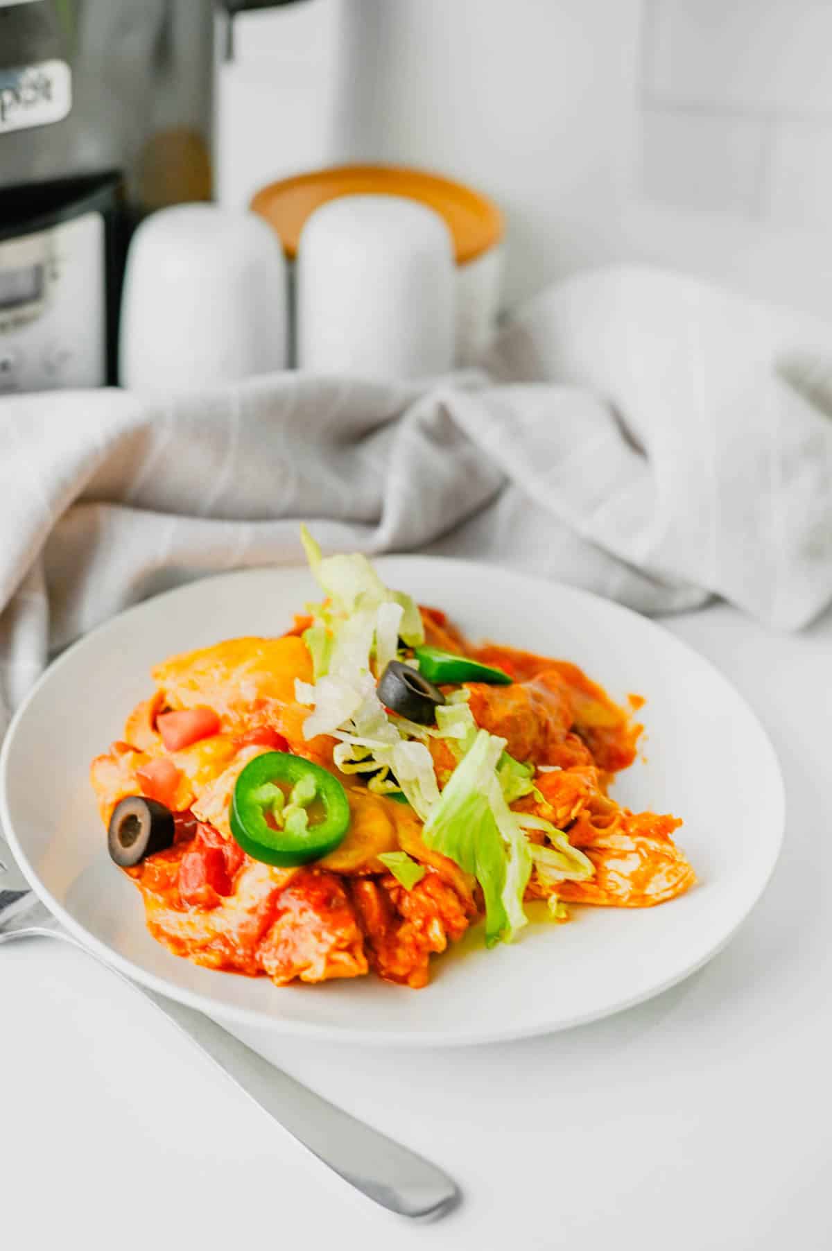 This Crock Pot Chicken Enchilada Casserole is the ultimate easy family dinner packed with tender shredded chicken, enchilada sauce, corn tortillas, Rotel tomatoes, and melted Mexican cheese. If you're looking for Crockpot Chicken Recipes, Slow Cooker Chicken Recipes, Easy Crockpot Meals, or Dump And Go Crockpot Dinners, this simple recipe is a must-try. Perfect for busy weeknights, meal prep, and feeding a hungry family, this cheesy casserole delivers all the flavors of classic chicken enchiladas with minimal effort. Whether you love Mexican Casserole Recipes, Chicken Enchilada Casserole, Crockpot Mexican Chicken, Easy Dinner Recipes, or Comfort Food Dinners, this hearty meal is guaranteed to become a regular part of your dinner rotation. Save this delicious slow cooker recipe for later!