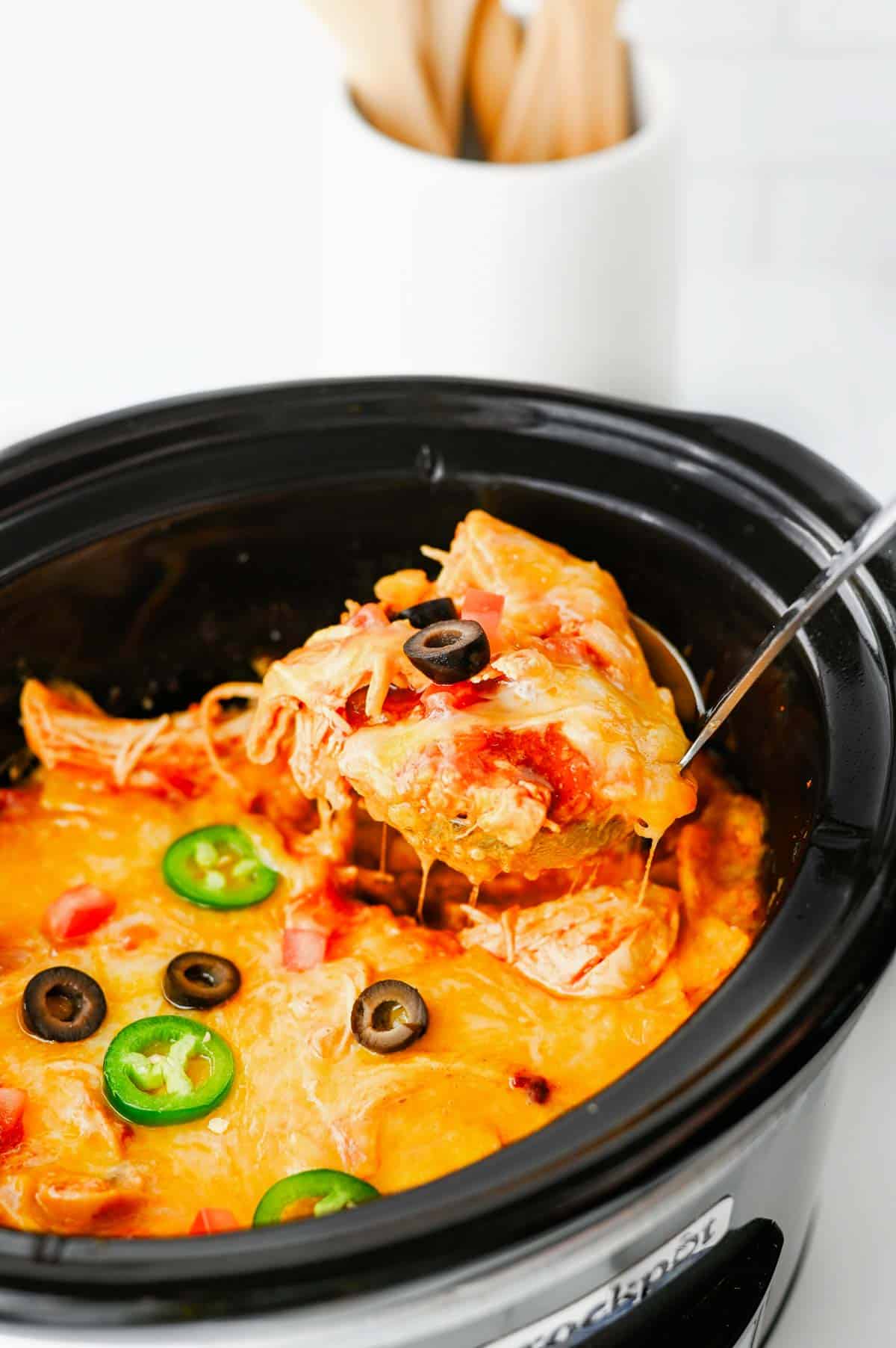 This Crock Pot Chicken Enchilada Casserole is the ultimate easy family dinner packed with tender shredded chicken, enchilada sauce, corn tortillas, Rotel tomatoes, and melted Mexican cheese. If you're looking for Crockpot Chicken Recipes, Slow Cooker Chicken Recipes, Easy Crockpot Meals, or Dump And Go Crockpot Dinners, this simple recipe is a must-try. Perfect for busy weeknights, meal prep, and feeding a hungry family, this cheesy casserole delivers all the flavors of classic chicken enchiladas with minimal effort. Whether you love Mexican Casserole Recipes, Chicken Enchilada Casserole, Crockpot Mexican Chicken, Easy Dinner Recipes, or Comfort Food Dinners, this hearty meal is guaranteed to become a regular part of your dinner rotation. Save this delicious slow cooker recipe for later!