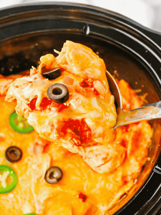 This Crock Pot Chicken Enchilada Casserole is the ultimate easy family dinner packed with tender shredded chicken, enchilada sauce, corn tortillas, Rotel tomatoes, and melted Mexican cheese. If you're looking for Crockpot Chicken Recipes, Slow Cooker Chicken Recipes, Easy Crockpot Meals, or Dump And Go Crockpot Dinners, this simple recipe is a must-try. Perfect for busy weeknights, meal prep, and feeding a hungry family, this cheesy casserole delivers all the flavors of classic chicken enchiladas with minimal effort. Whether you love Mexican Casserole Recipes, Chicken Enchilada Casserole, Crockpot Mexican Chicken, Easy Dinner Recipes, or Comfort Food Dinners, this hearty meal is guaranteed to become a regular part of your dinner rotation. Save this delicious slow cooker recipe for later!