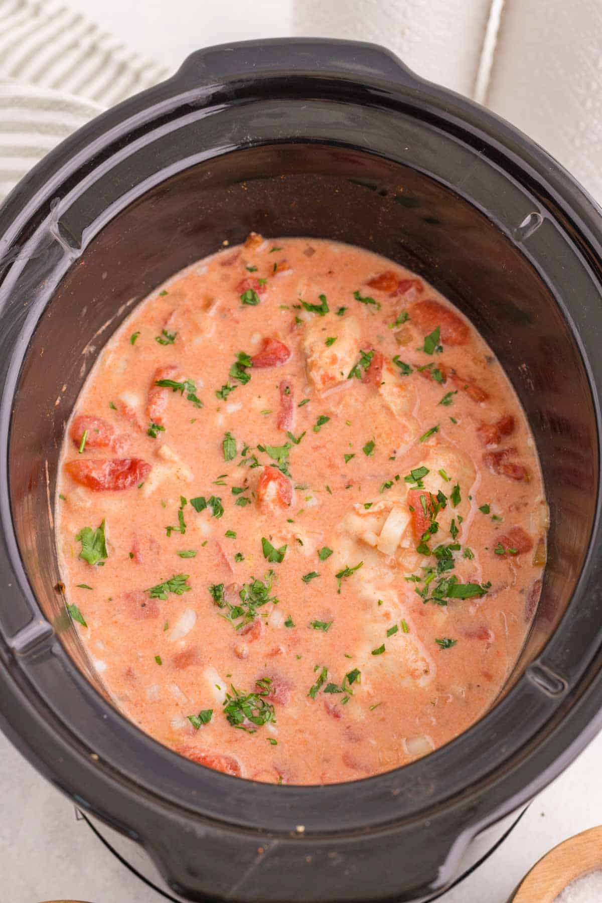 This Slow Cooker Chicken Paprikash is the ultimate comfort food dinner for busy weeknights. Tender chicken breasts cook low and slow with onions, tomatoes, and plenty of sweet paprika to create a rich, flavorful sauce that tastes like it simmered all day. A generous scoop of sour cream stirred in at the end gives this classic Hungarian-inspired dish its signature creamy texture. Serve it over egg noodles, rice, or mashed potatoes for a hearty family meal everyone will love. If you're looking for easy slow cooker chicken recipes, crock pot comfort food, cozy dinner ideas, or simple meals packed with flavor, this Chicken Paprikash recipe is a must-try. It's easy to prep, incredibly satisfying, and perfect for feeding a hungry crowd with minimal effort.