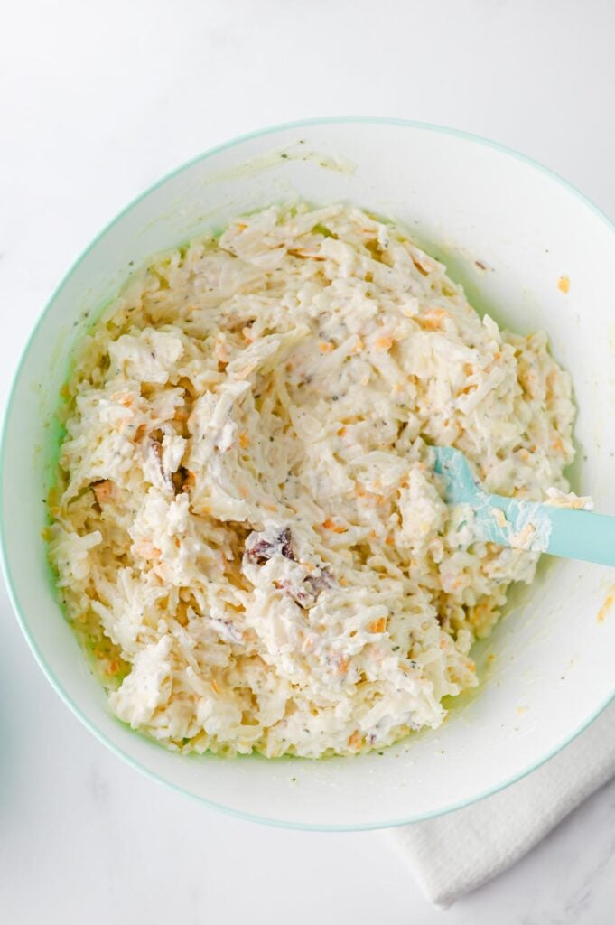 creamy hash brown mixture in a mixing bowl