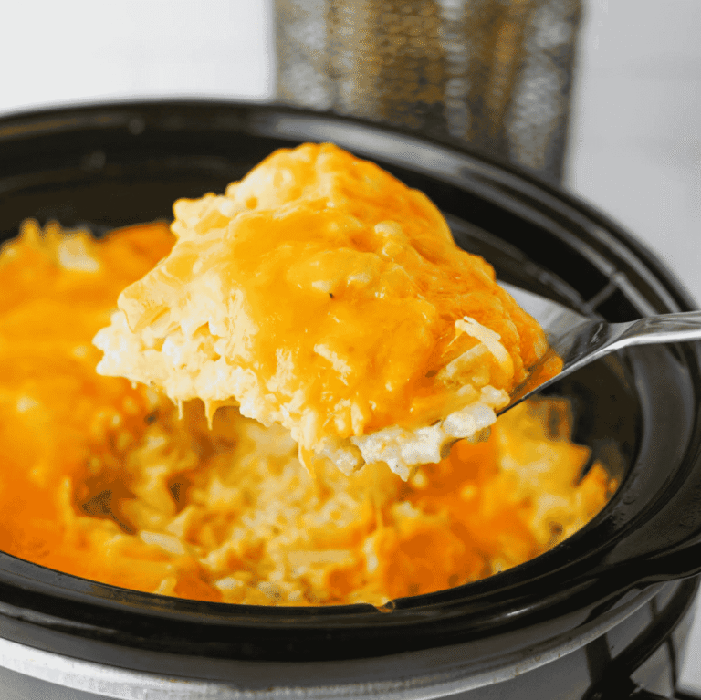 This Crock Pot Cheesy Bacon Hashbrown Casserole is the ultimate comfort food side dish for holidays, potlucks, family dinners, and busy weeknights. Loaded with frozen hashbrowns, crispy bacon, cheddar cheese, sour cream, and a rich homemade cheese sauce, this Slow Cooker Hashbrown Casserole is creamy, hearty, and packed with flavor. If you're searching for Crockpot Potato Recipes, Cheesy Hashbrown Casserole, Funeral Potatoes, Slow Cooker Side Dishes, Potato Casserole Recipes, Crock Pot Potatoes, Easy Holiday Side Dishes, Make Ahead Side Dishes, or Easy Potluck Recipes, this recipe is a must-try. Perfect for Thanksgiving, Christmas, Easter, brunch gatherings, and comfort food dinners, this cheesy bacon potato casserole always disappears fast.
