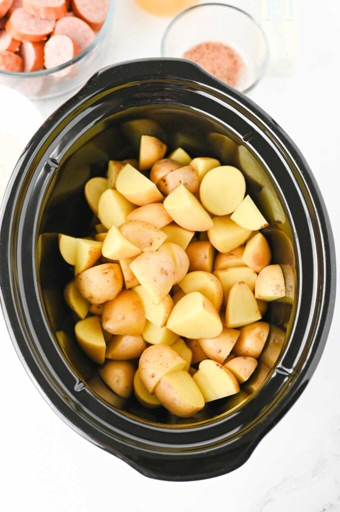 chopped potatoes in a slow cooker