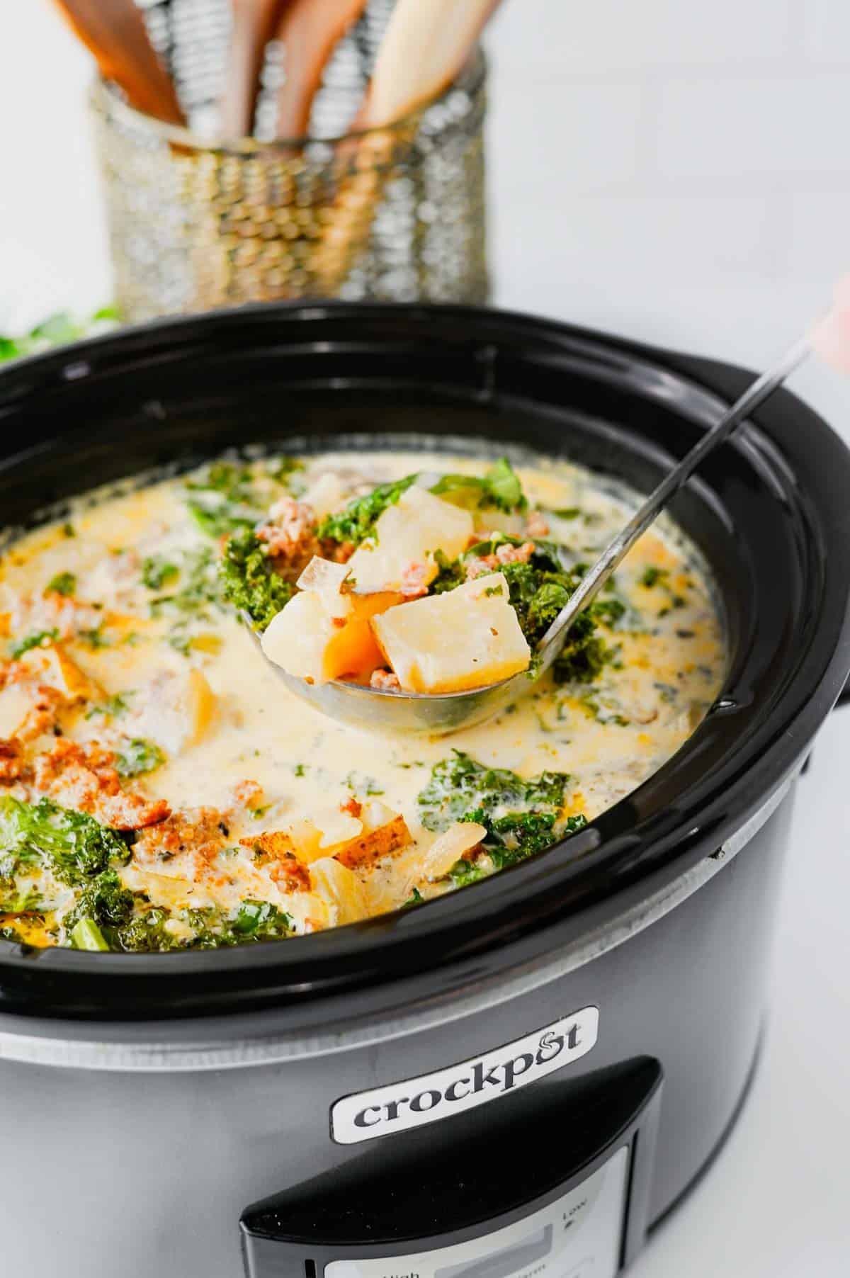 This Crockpot Zuppa Toscana is the ultimate comfort soup recipe loaded with Italian sausage, potatoes, bacon, kale and a rich creamy broth. If you love Copycat Olive Garden Zuppa Toscana, this Slow Cooker Zuppa Toscana is an easy family dinner that tastes even better than the restaurant version. Learn How To Make Olive Garden Zuppa Toscana at home with simple ingredients and minimal prep. This Zuppa Toscana Soup Recipe is perfect for busy weeknights, cozy weekends and feeding a crowd. Whether you're searching for Easy Soup Recipes, Italian Soup Recipes, Sausage And Kale Soup, Kale Soup Recipes, Homemade Soup Recipe ideas or a delicious Crockpot Zuppa Toscana, this hearty Toscana Soup delivers big flavor in every bite. Save this Easy Zuppa Toscana Soup for your next Soup Dinner night!