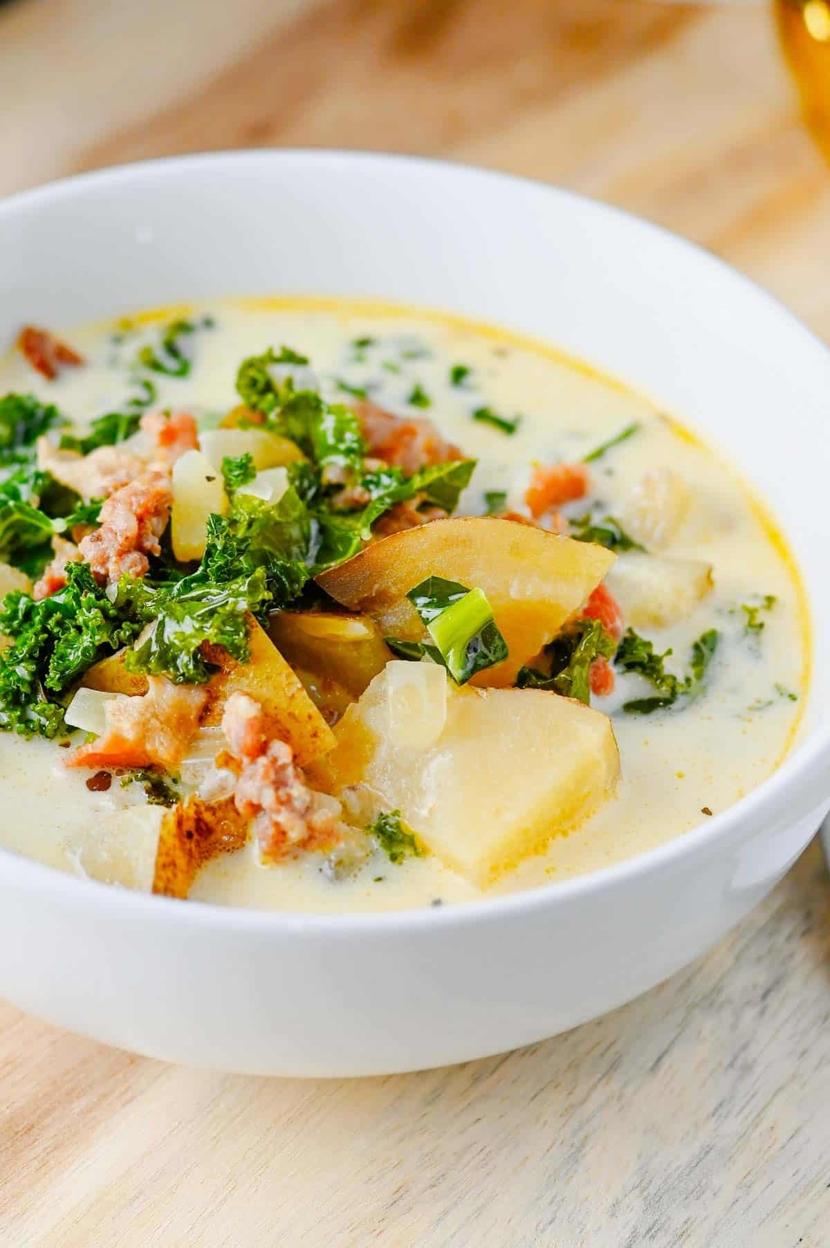 This Crockpot Zuppa Toscana is the ultimate comfort soup recipe loaded with Italian sausage, potatoes, bacon, kale and a rich creamy broth. If you love Copycat Olive Garden Zuppa Toscana, this Slow Cooker Zuppa Toscana is an easy family dinner that tastes even better than the restaurant version. Learn How To Make Olive Garden Zuppa Toscana at home with simple ingredients and minimal prep. This Zuppa Toscana Soup Recipe is perfect for busy weeknights, cozy weekends and feeding a crowd. Whether you're searching for Easy Soup Recipes, Italian Soup Recipes, Sausage And Kale Soup, Kale Soup Recipes, Homemade Soup Recipe ideas or a delicious Crockpot Zuppa Toscana, this hearty Toscana Soup delivers big flavor in every bite. Save this Easy Zuppa Toscana Soup for your next Soup Dinner night!