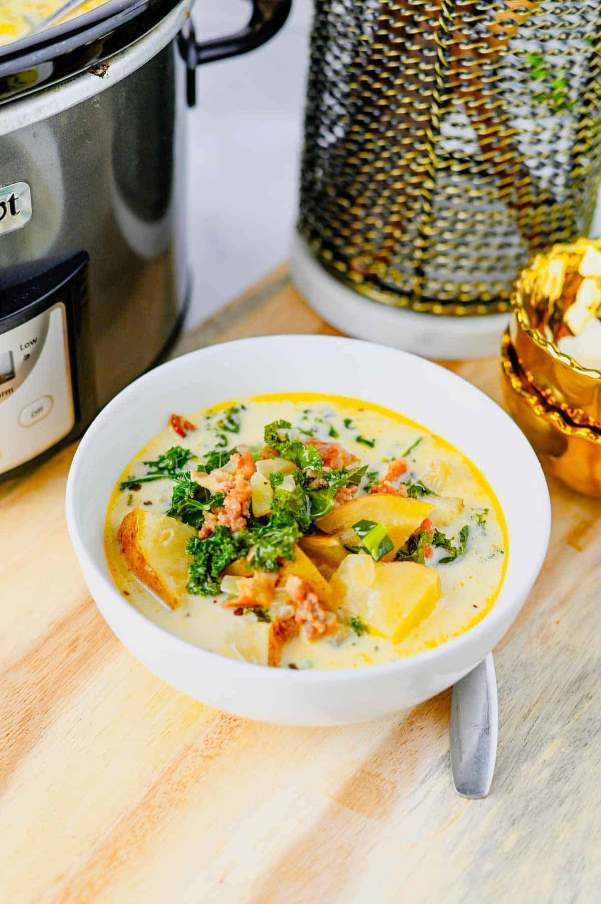 This Crockpot Zuppa Toscana is the ultimate comfort soup recipe loaded with Italian sausage, potatoes, bacon, kale and a rich creamy broth. If you love Copycat Olive Garden Zuppa Toscana, this Slow Cooker Zuppa Toscana is an easy family dinner that tastes even better than the restaurant version. Learn How To Make Olive Garden Zuppa Toscana at home with simple ingredients and minimal prep. This Zuppa Toscana Soup Recipe is perfect for busy weeknights, cozy weekends and feeding a crowd. Whether you're searching for Easy Soup Recipes, Italian Soup Recipes, Sausage And Kale Soup, Kale Soup Recipes, Homemade Soup Recipe ideas or a delicious Crockpot Zuppa Toscana, this hearty Toscana Soup delivers big flavor in every bite. Save this Easy Zuppa Toscana Soup for your next Soup Dinner night!