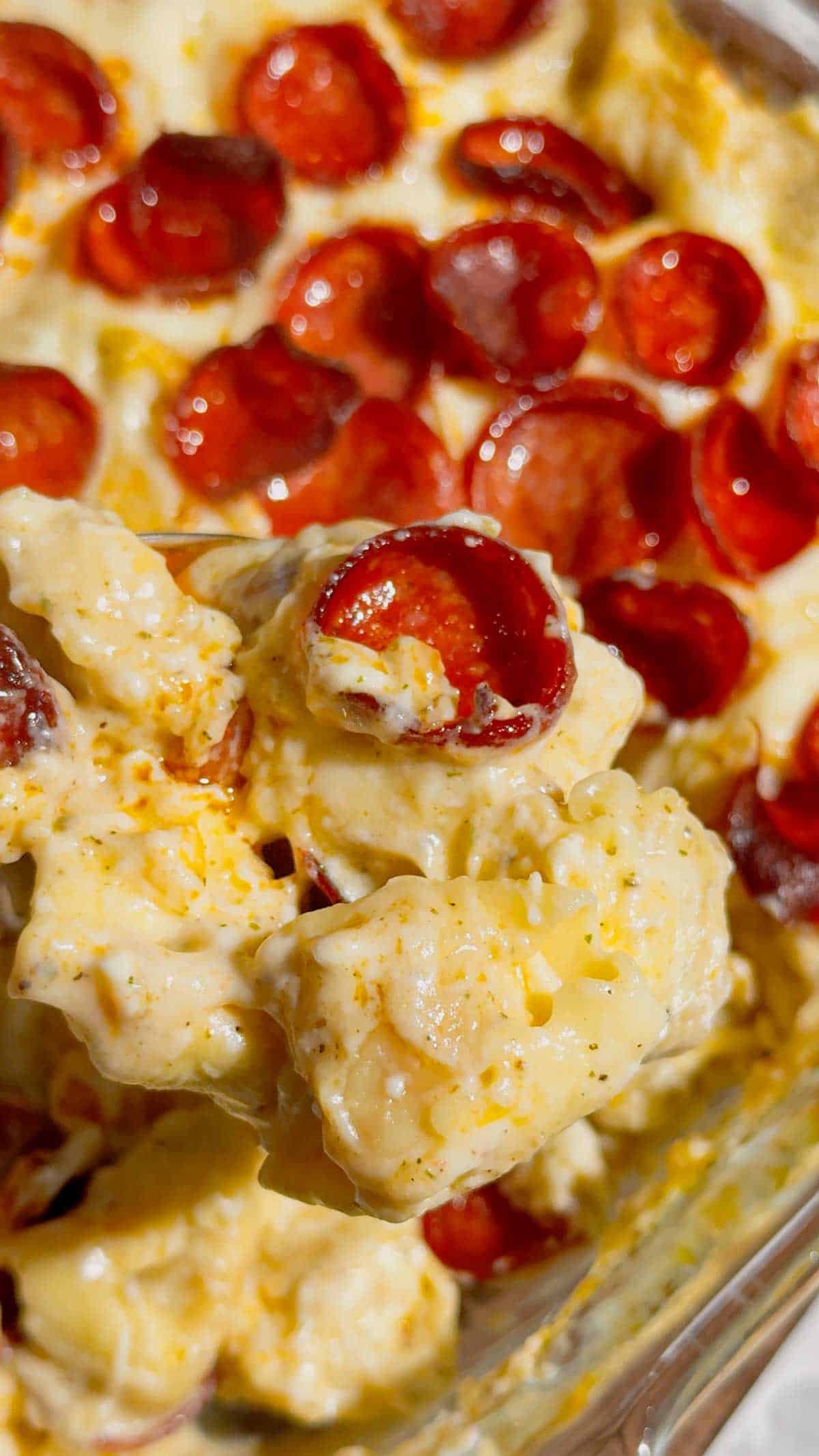 This Dump and Bake Pepperoni Tortellini Alfredo is the ultimate easy dinner recipe for busy families. Cheese-filled tortellini is tossed with creamy Alfredo sauce, Italian seasoning, mozzarella cheese, and crispy pepperoni, then baked until hot and bubbly. If you're looking for simple casserole recipes, easy pasta bake recipes, or family dinner ideas everyone will love, this cheesy tortellini casserole is a must-try. Perfect for weeknight meals, potlucks, and comfort food cravings, this dump and bake pasta recipe requires minimal prep and delivers maximum flavor. Save this pepperoni tortellini Alfredo recipe for an easy baked pasta dinner, cheesy casserole recipe, or quick family meal that will have everyone asking for seconds.