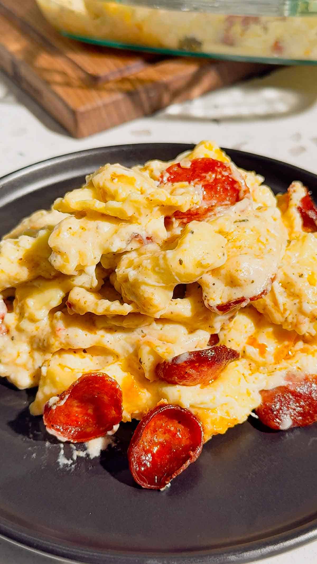 This Dump and Bake Pepperoni Tortellini Alfredo is the ultimate easy dinner recipe for busy families. Cheese-filled tortellini is tossed with creamy Alfredo sauce, Italian seasoning, mozzarella cheese, and crispy pepperoni, then baked until hot and bubbly. If you're looking for simple casserole recipes, easy pasta bake recipes, or family dinner ideas everyone will love, this cheesy tortellini casserole is a must-try. Perfect for weeknight meals, potlucks, and comfort food cravings, this dump and bake pasta recipe requires minimal prep and delivers maximum flavor. Save this pepperoni tortellini Alfredo recipe for an easy baked pasta dinner, cheesy casserole recipe, or quick family meal that will have everyone asking for seconds.