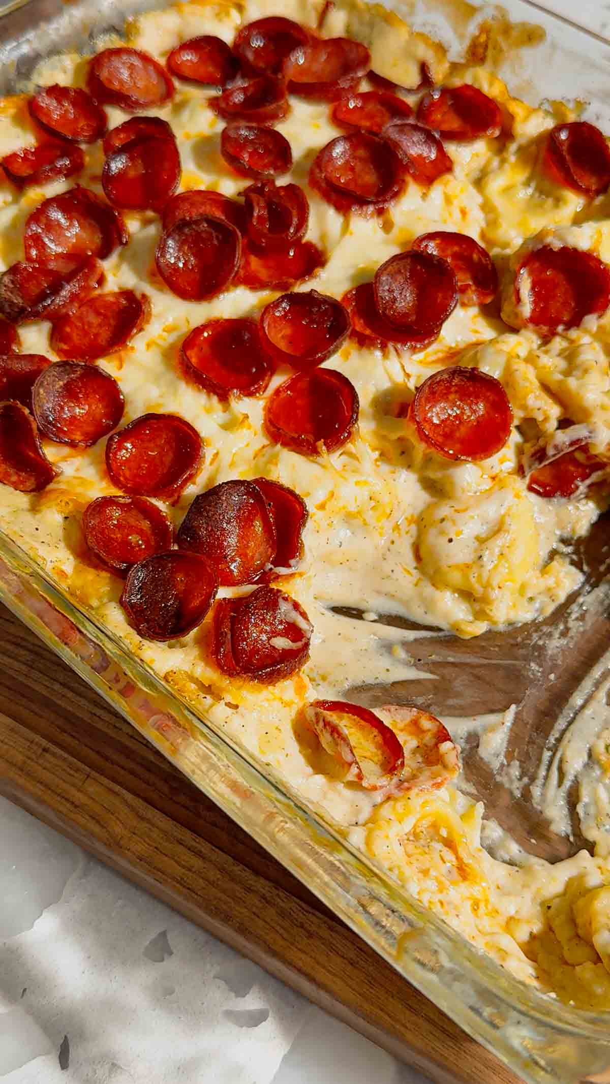 This Dump and Bake Pepperoni Tortellini Alfredo is the ultimate easy dinner recipe for busy families. Cheese-filled tortellini is tossed with creamy Alfredo sauce, Italian seasoning, mozzarella cheese, and crispy pepperoni, then baked until hot and bubbly. If you're looking for simple casserole recipes, easy pasta bake recipes, or family dinner ideas everyone will love, this cheesy tortellini casserole is a must-try. Perfect for weeknight meals, potlucks, and comfort food cravings, this dump and bake pasta recipe requires minimal prep and delivers maximum flavor. Save this pepperoni tortellini Alfredo recipe for an easy baked pasta dinner, cheesy casserole recipe, or quick family meal that will have everyone asking for seconds.