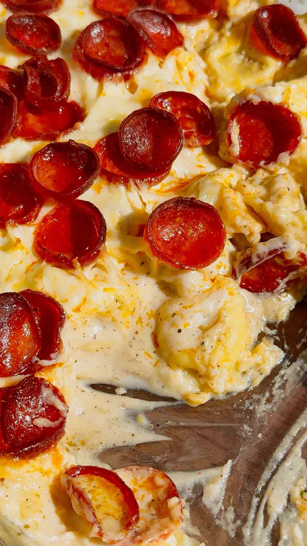This Dump and Bake Pepperoni Tortellini Alfredo is the ultimate easy dinner recipe for busy families. Cheese-filled tortellini is tossed with creamy Alfredo sauce, Italian seasoning, mozzarella cheese, and crispy pepperoni, then baked until hot and bubbly. If you're looking for simple casserole recipes, easy pasta bake recipes, or family dinner ideas everyone will love, this cheesy tortellini casserole is a must-try. Perfect for weeknight meals, potlucks, and comfort food cravings, this dump and bake pasta recipe requires minimal prep and delivers maximum flavor. Save this pepperoni tortellini Alfredo recipe for an easy baked pasta dinner, cheesy casserole recipe, or quick family meal that will have everyone asking for seconds.