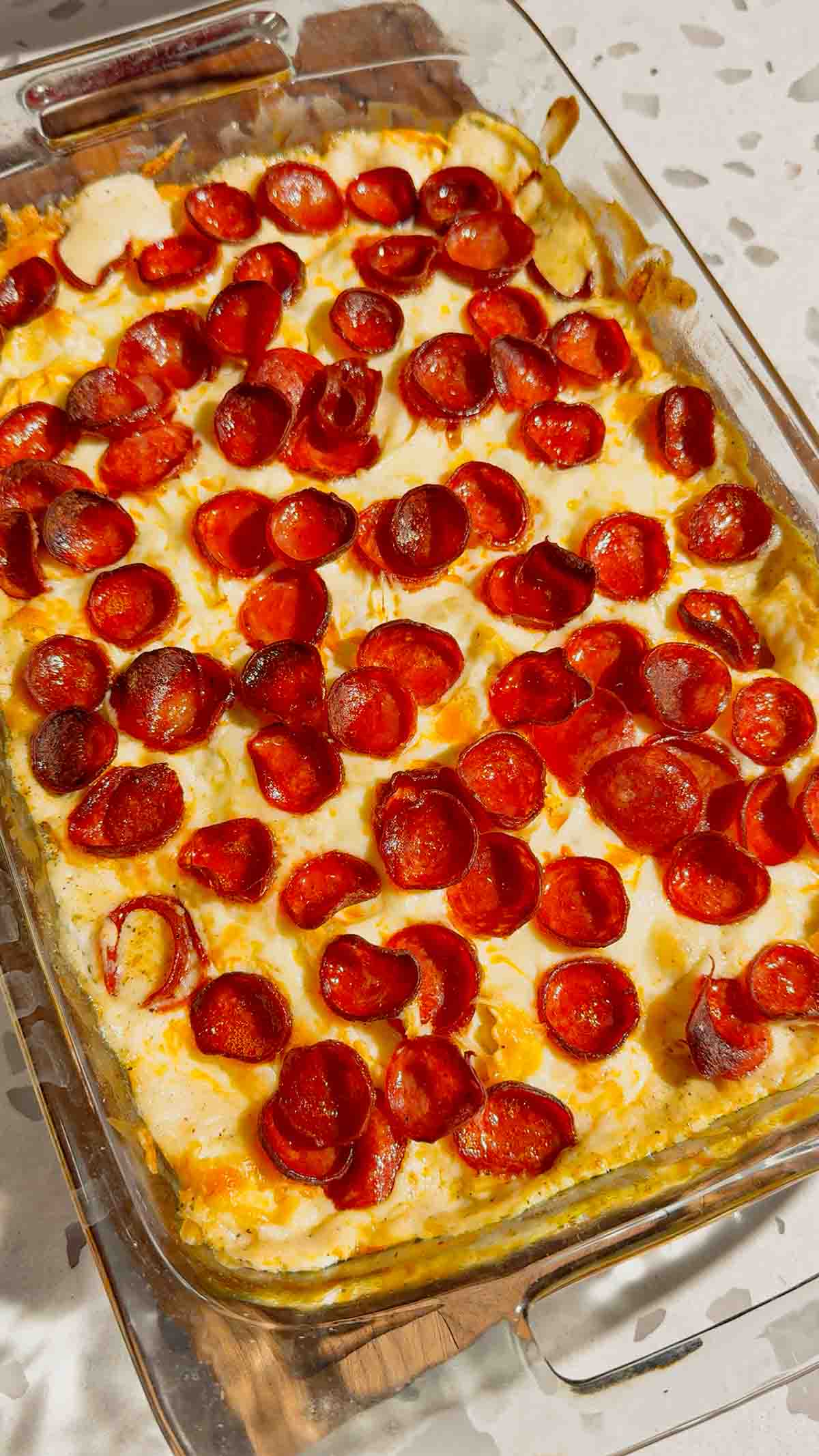 This Dump and Bake Pepperoni Tortellini Alfredo is the ultimate easy dinner recipe for busy families. Cheese-filled tortellini is tossed with creamy Alfredo sauce, Italian seasoning, mozzarella cheese, and crispy pepperoni, then baked until hot and bubbly. If you're looking for simple casserole recipes, easy pasta bake recipes, or family dinner ideas everyone will love, this cheesy tortellini casserole is a must-try. Perfect for weeknight meals, potlucks, and comfort food cravings, this dump and bake pasta recipe requires minimal prep and delivers maximum flavor. Save this pepperoni tortellini Alfredo recipe for an easy baked pasta dinner, cheesy casserole recipe, or quick family meal that will have everyone asking for seconds.